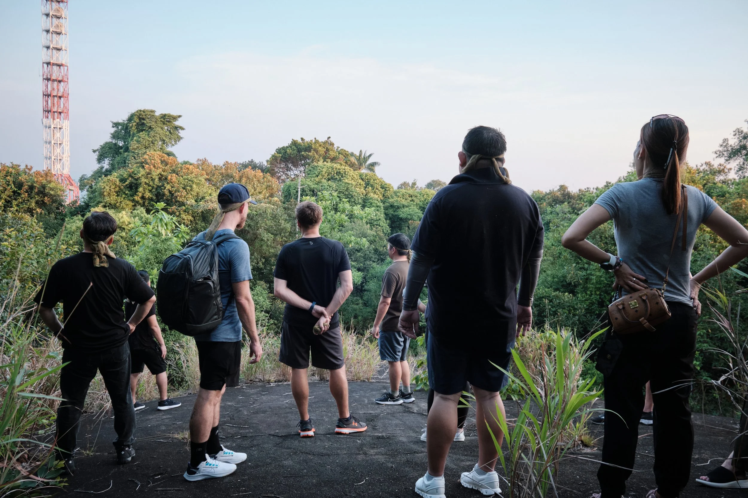 Team gathered together at dusk after a day of outdoor team building at Fort Serapong, Singapore