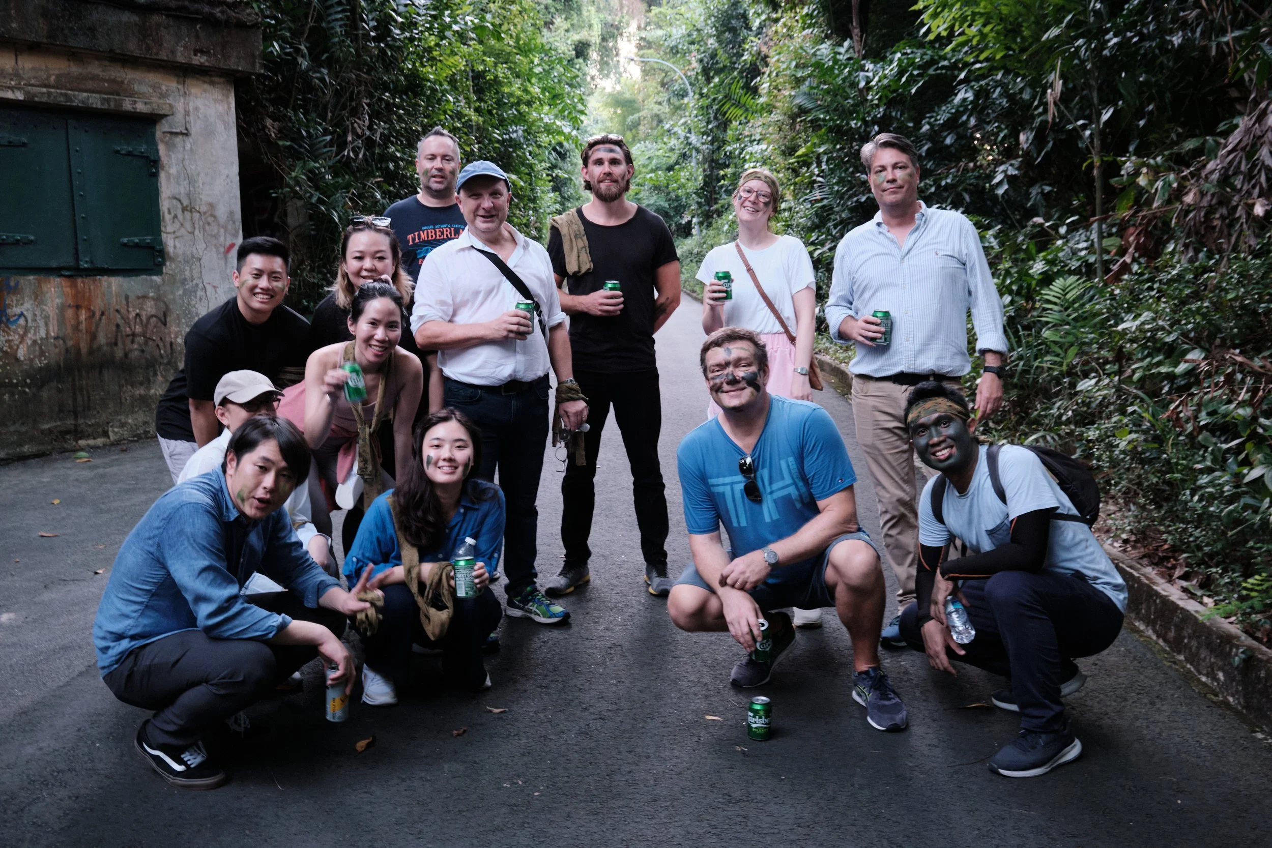 Global corporate team group photo after their Fort Serapong outdoor team bonding experience in Singapore