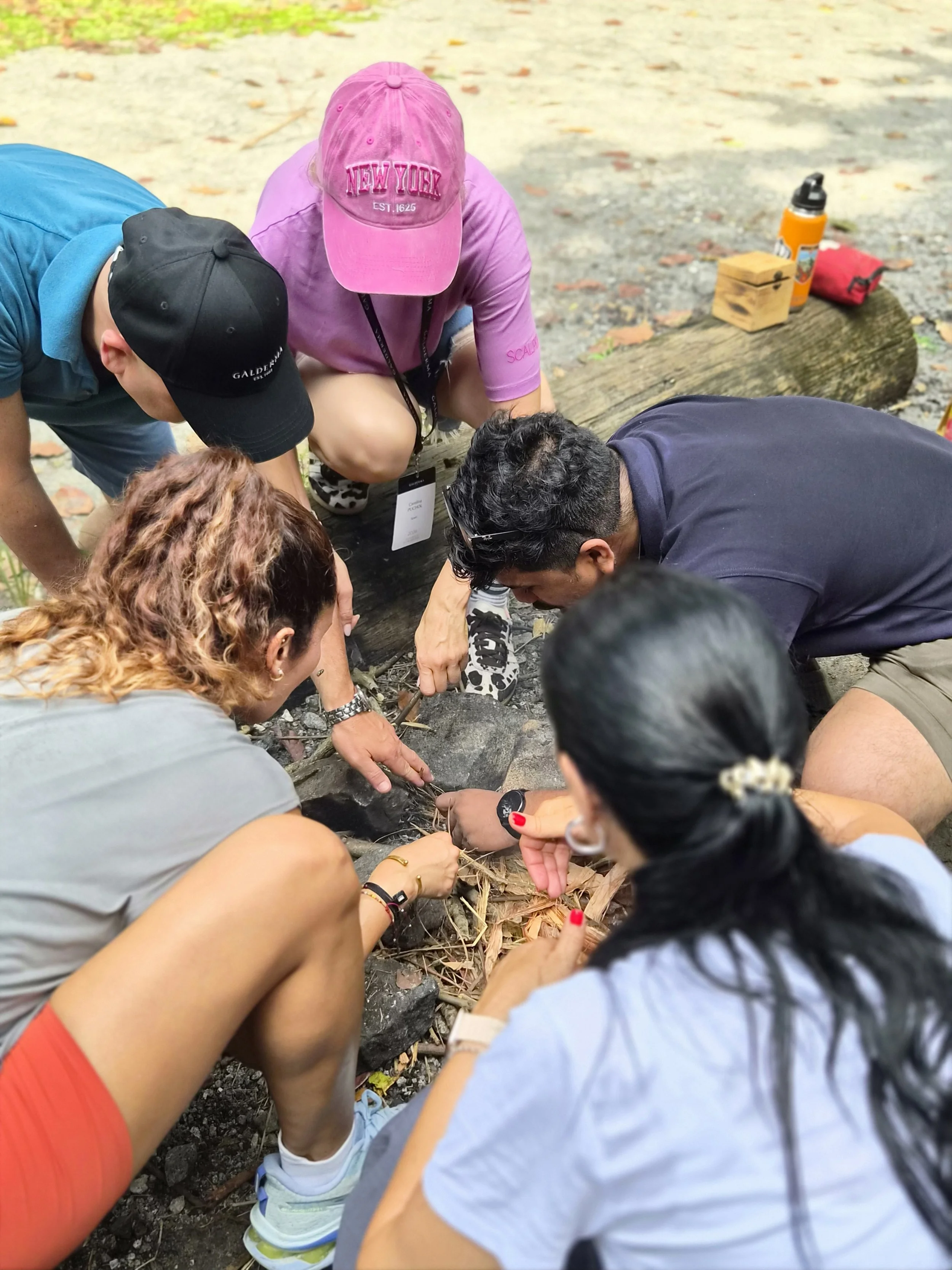 Small team focused on a bushcraft task as part of a hands-on incentive programme