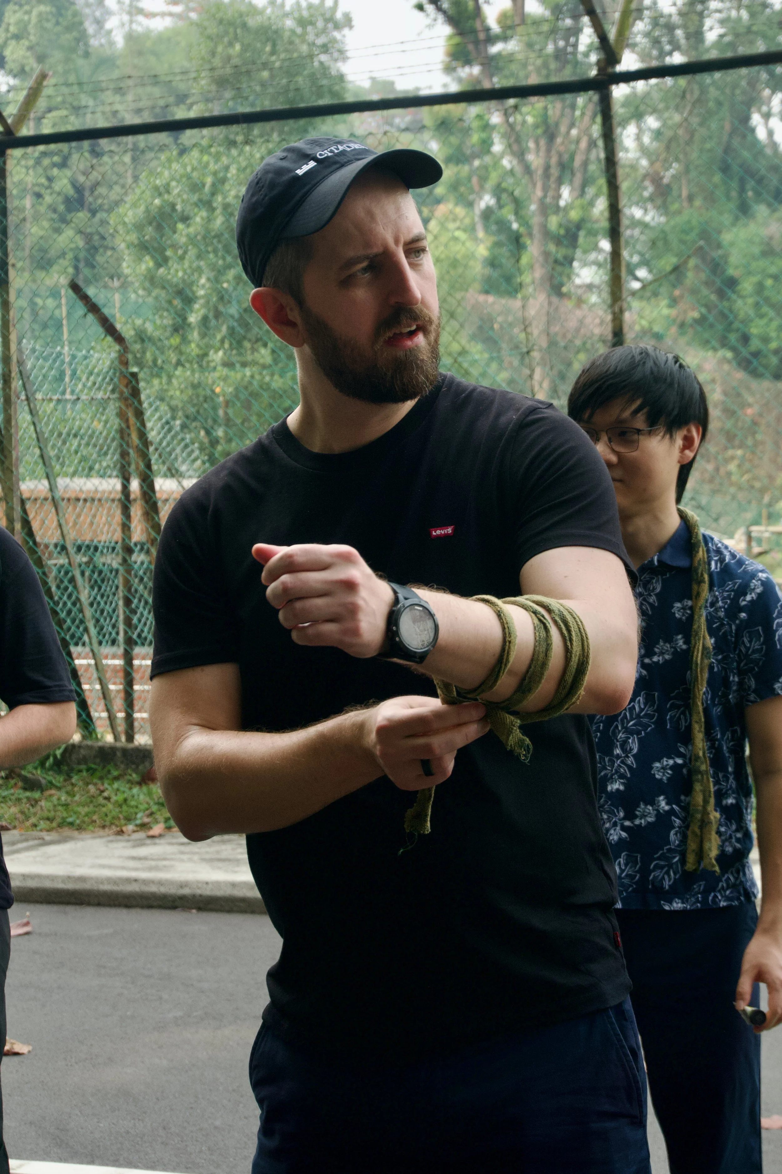 Citadel Securities participant holding camouflage cream before the Fort Serapong mission