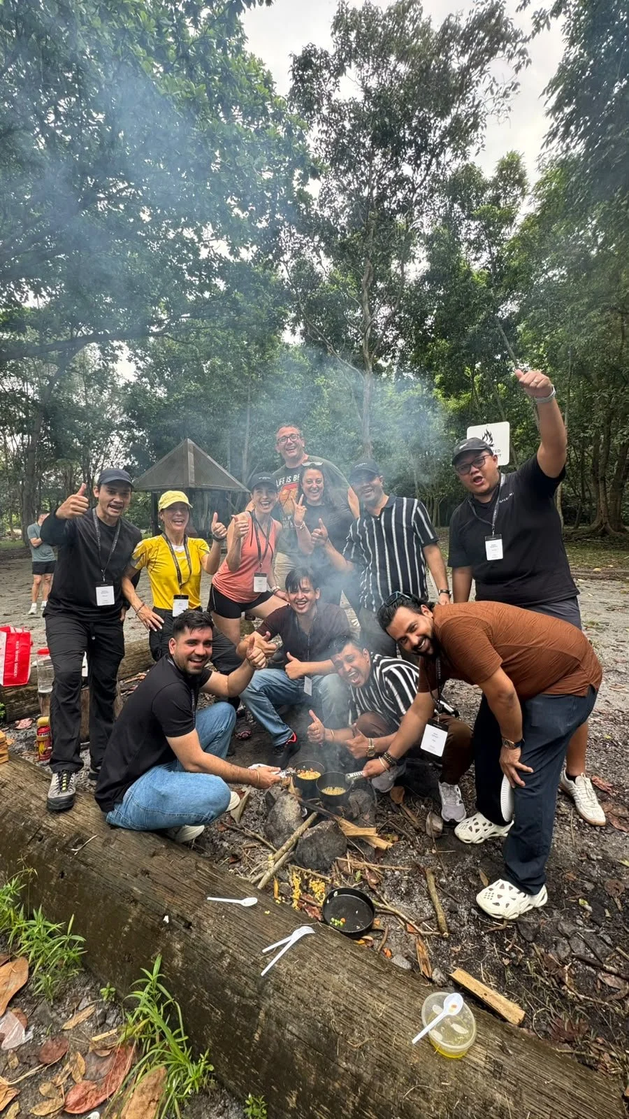 Galderma incentive group celebrating together around an outdoor fire in Singapore