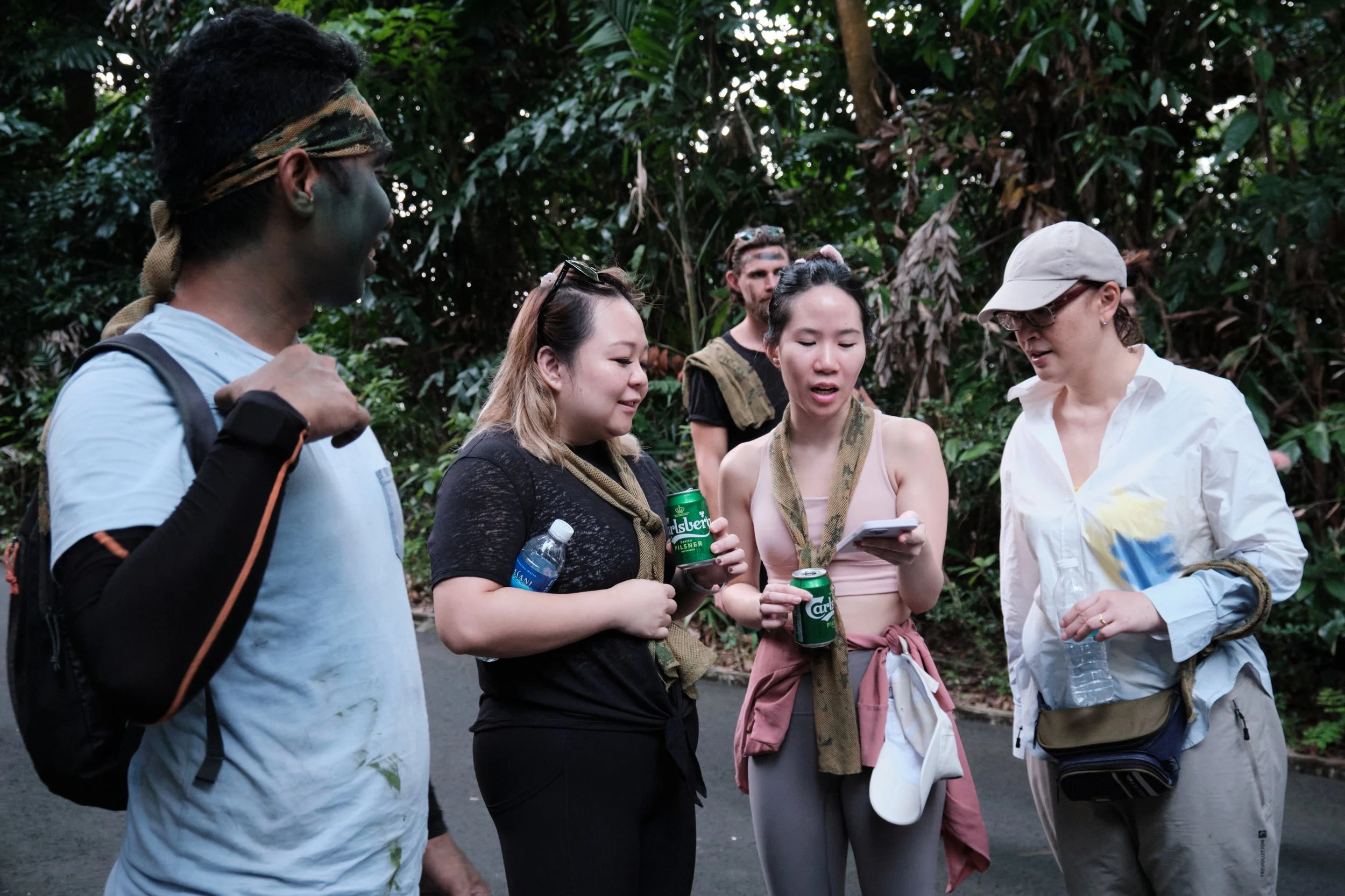 NORDEN team members talking and regrouping between team bonding challenges at Fort Serapong, Singapore