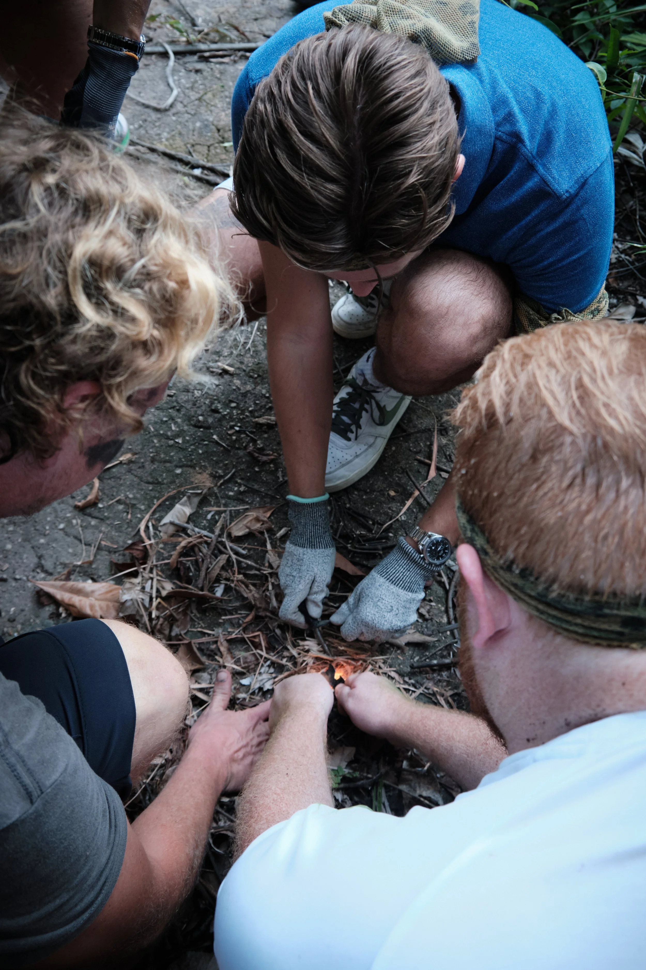 Hands-on fire-craft challenge during an outdoor team building programme at Fort Serapong, Singapore