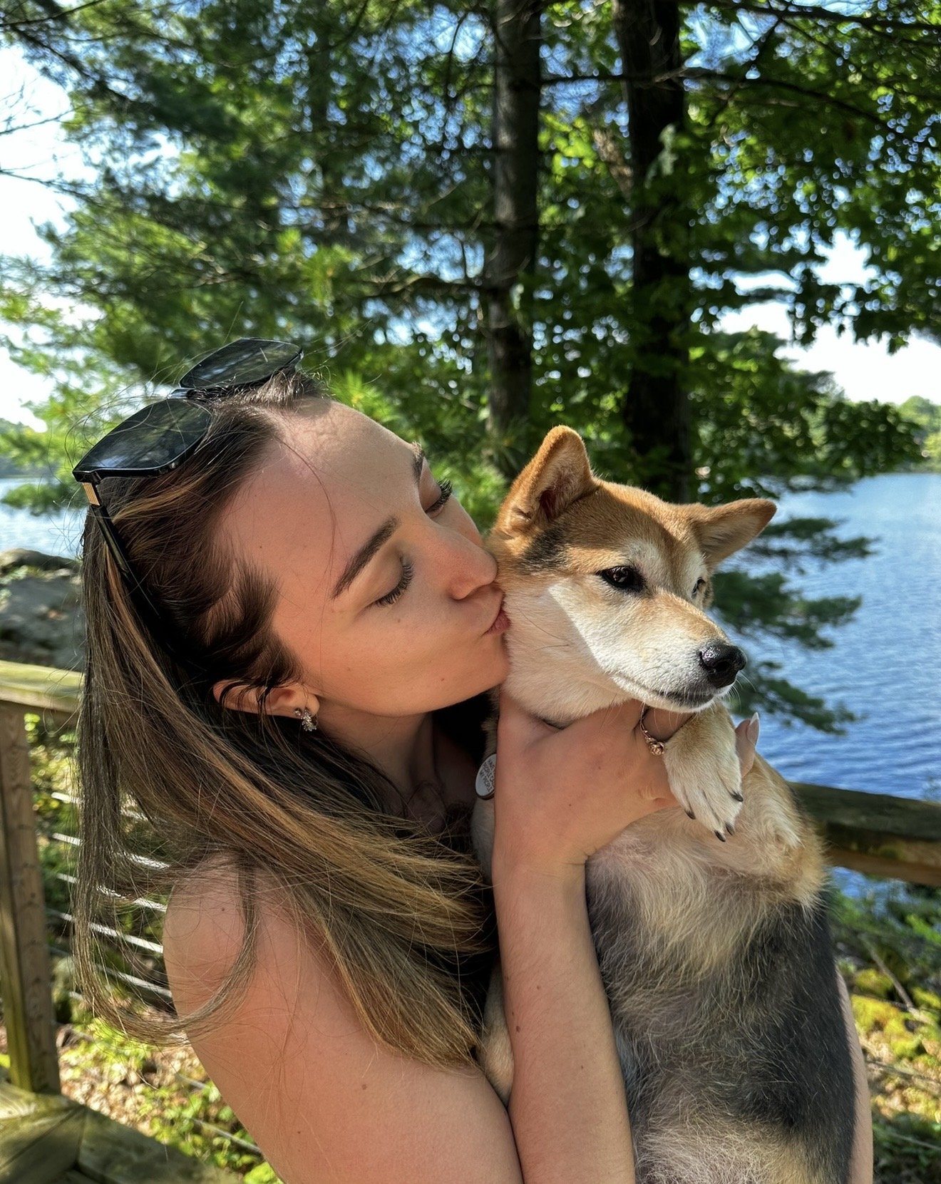 woman kissing her dog
