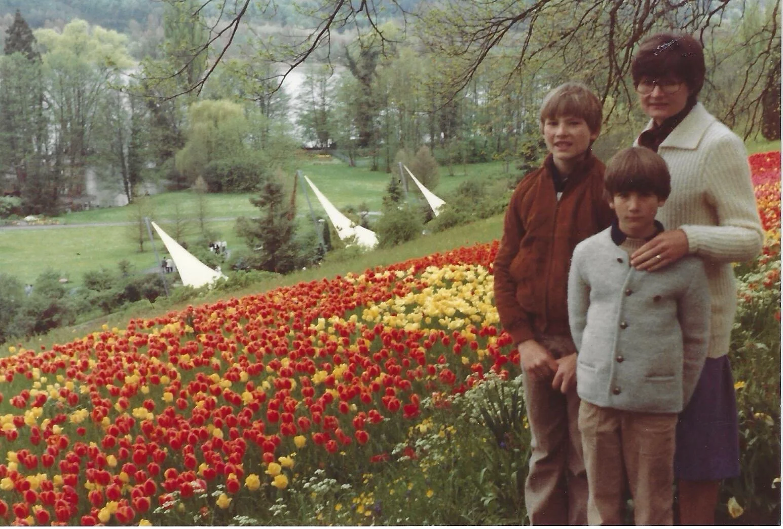 Andy, his brother, and mother in Austria at a tulip farm in 1982.