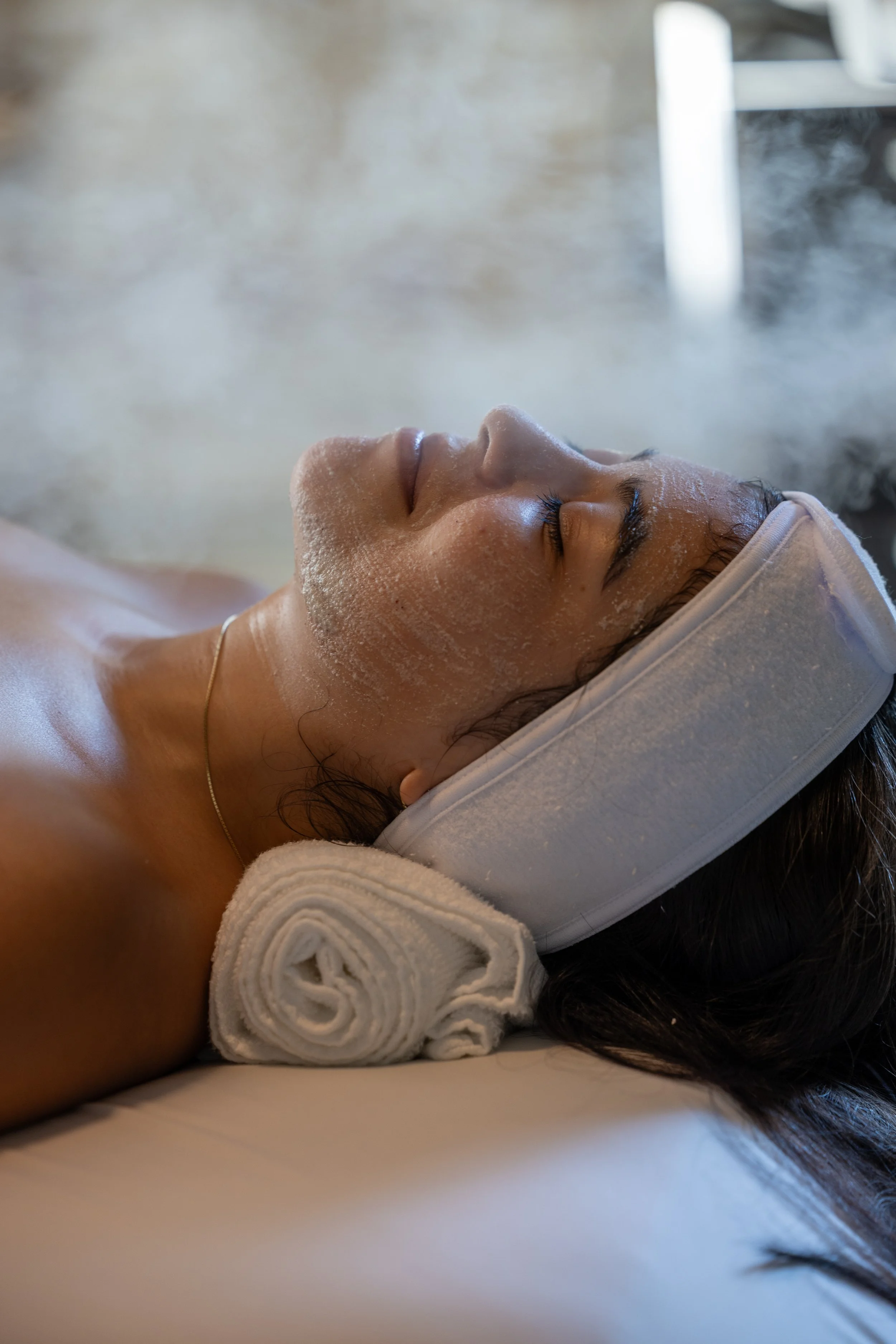 happy person getting facial