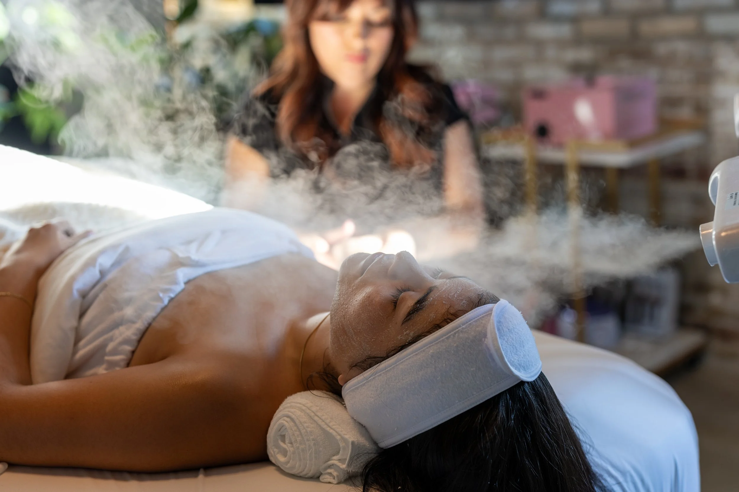 person getting steam during a facial