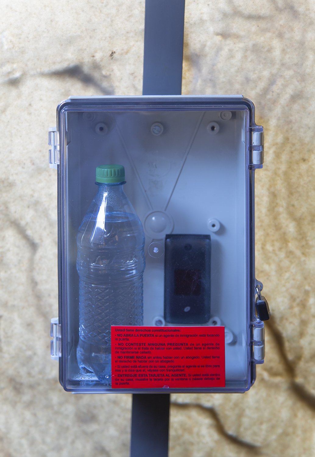   Detail , Cell phone, bottle of water, legal information  