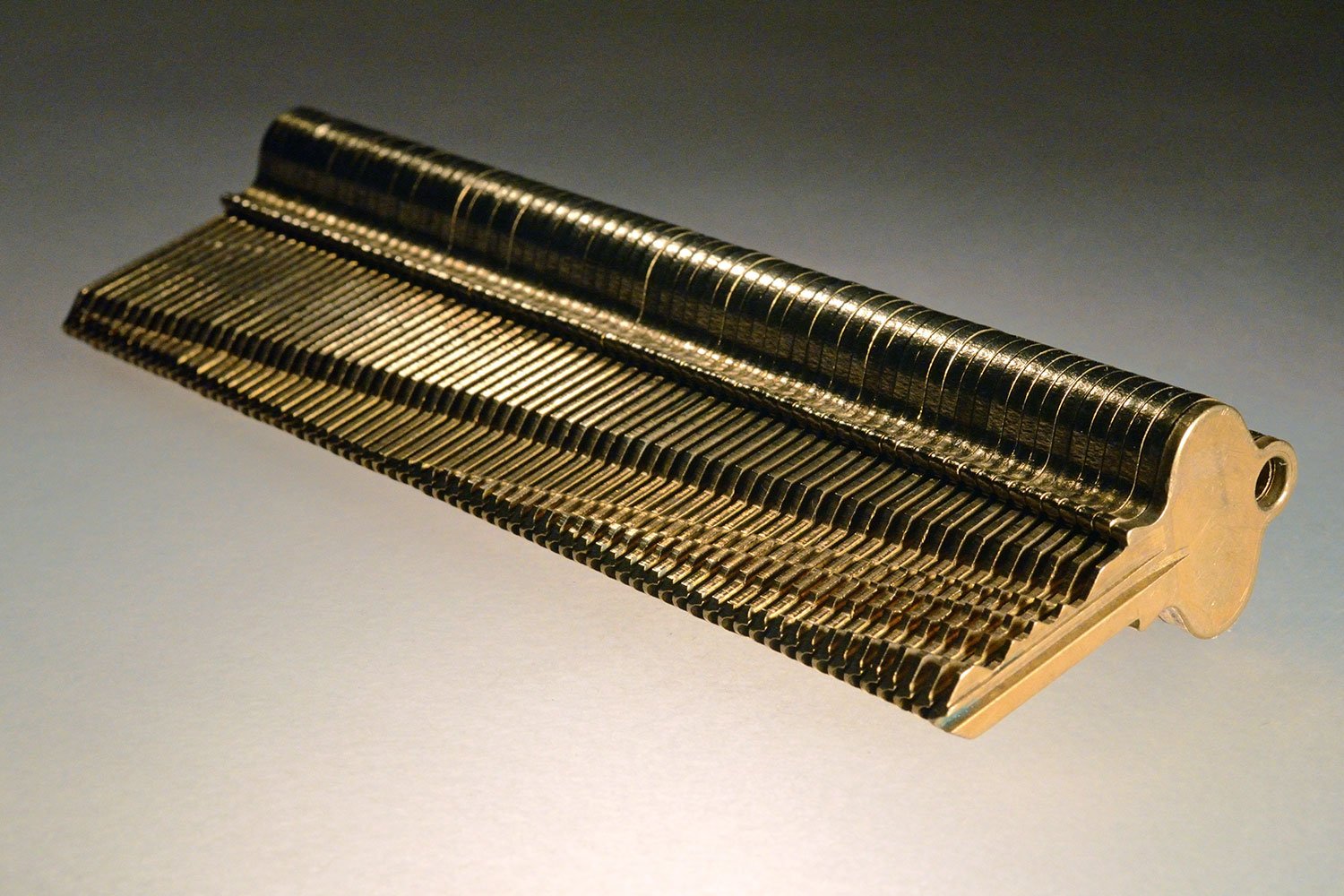   The Visual Topography of a Generation Gap (Brooklyn, NY, 1)  2011,     unique object, brass keys, 6 5/8 x 2 x 7/8 inches 