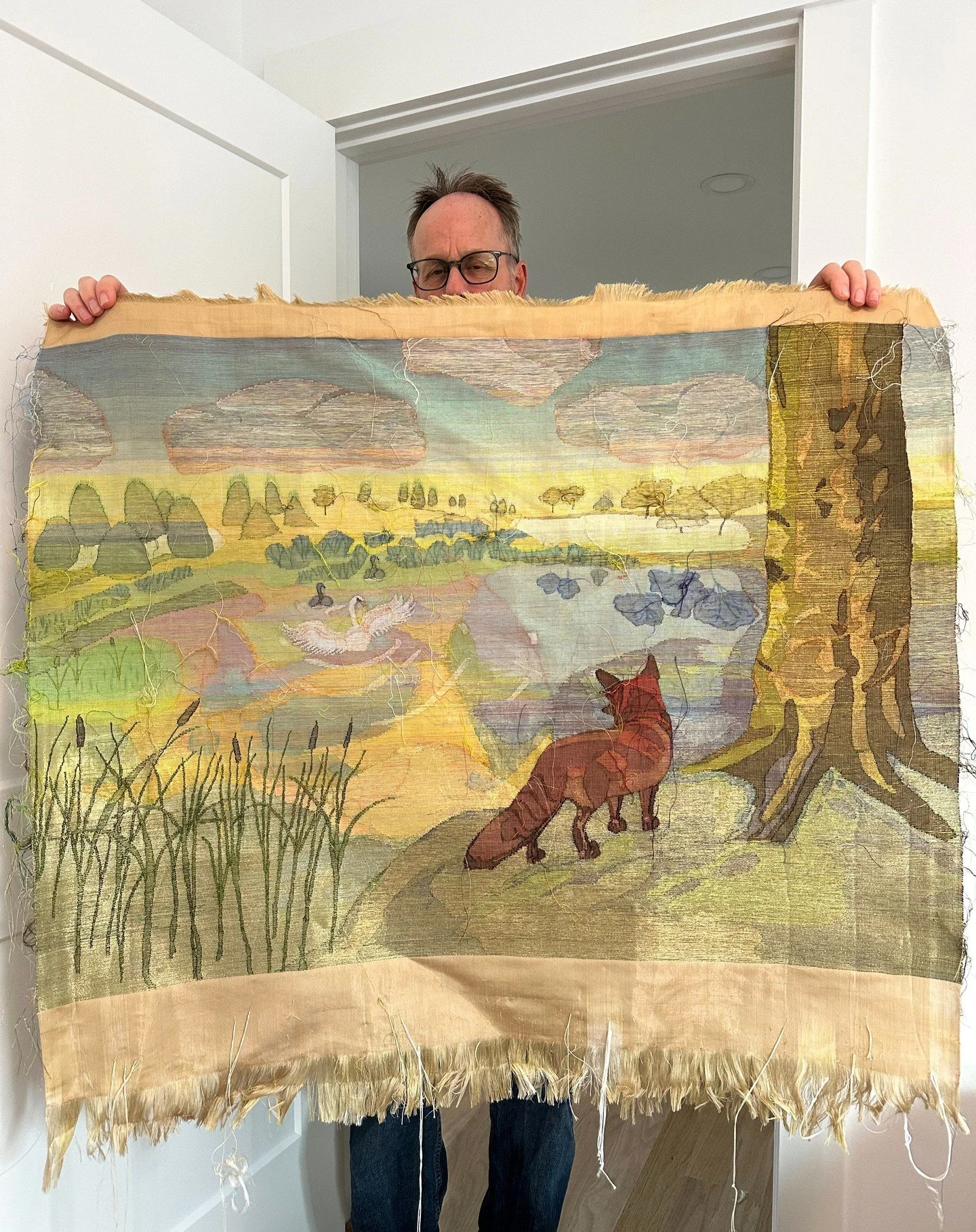 Good Evening!! Here is the fox and swan, fresh off the loom and held up by my wonderful husband. Yay!! Of course, I still have to do all of the cleanup work, sew on the backing, and have the same wonderful husband frame the piece. But, tomorrow will 