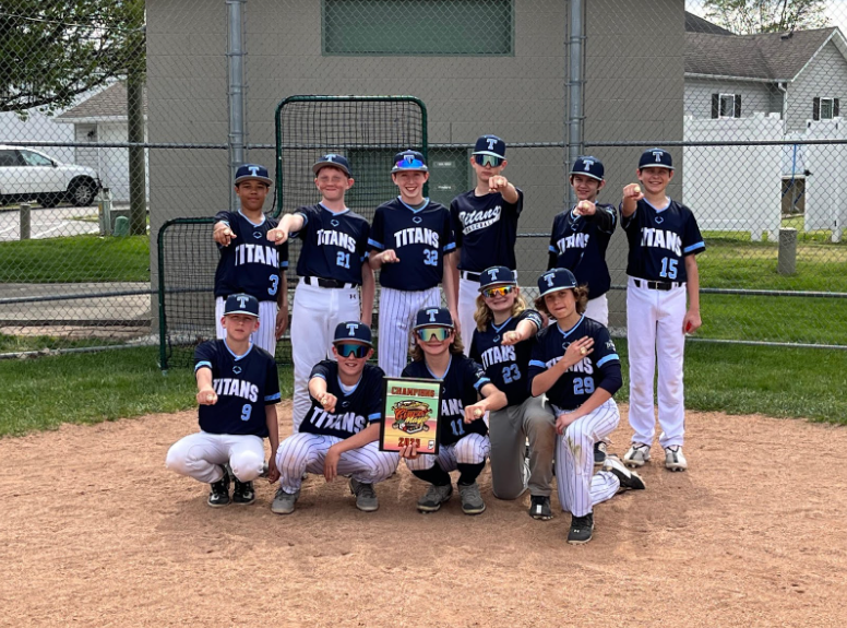 Dr. Drew's 2023 Champion Team. They are wearing black jerseys with Titans written in white letters.