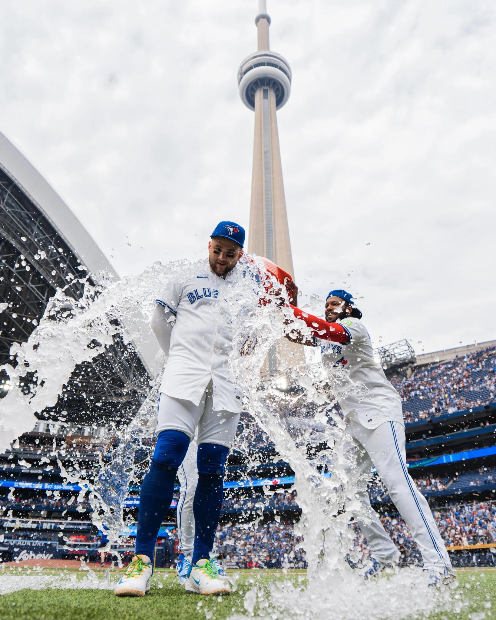 Vlad Jr throwing water on Bo Bichette