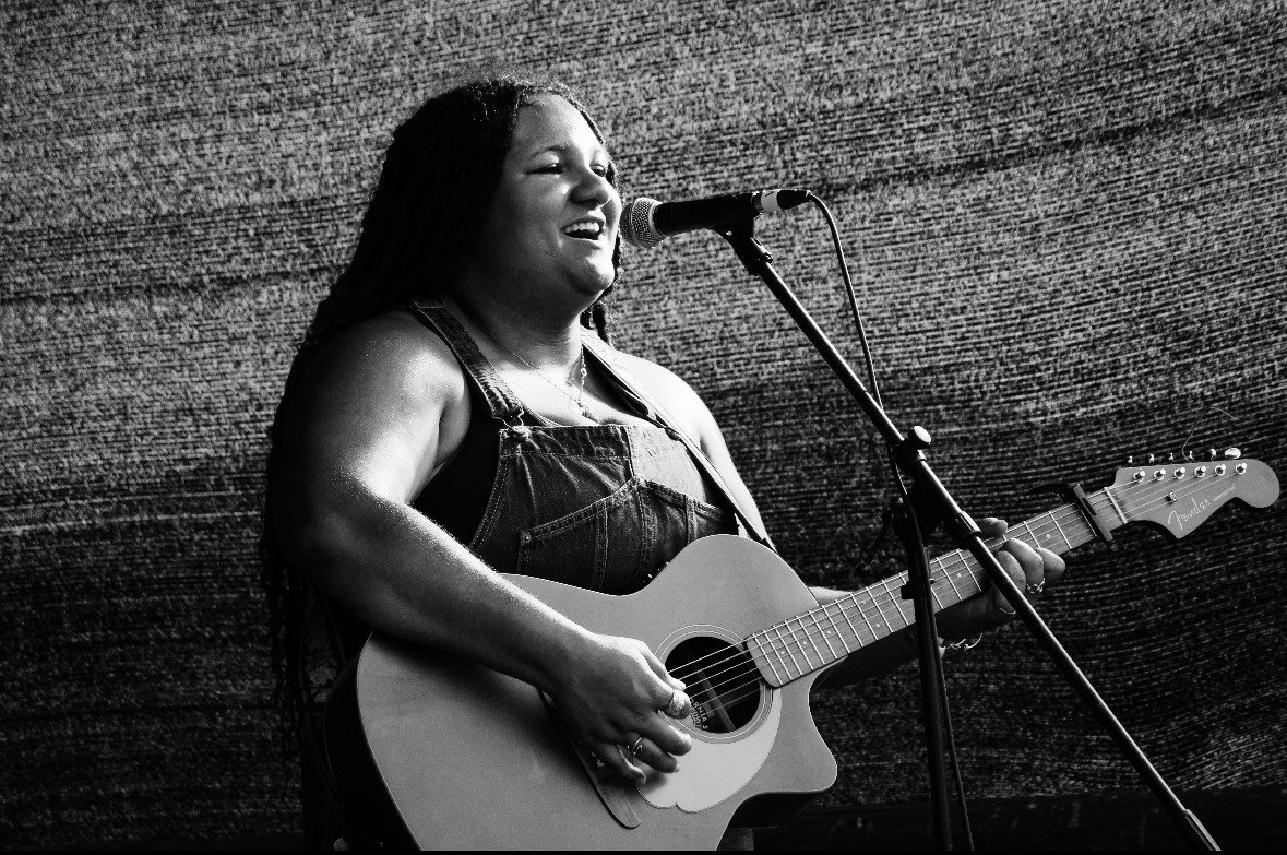 Tomorrow, Saturday June 21 Hannah Jackson starting at 6:00. Hannah is a singer songwriter who uses indie-folk guitar and warm americana style vocals to tell her stories. Inspired by artists like Bonnie Raitt, Phoebe Bridgers, The Indigo Girls and Mav