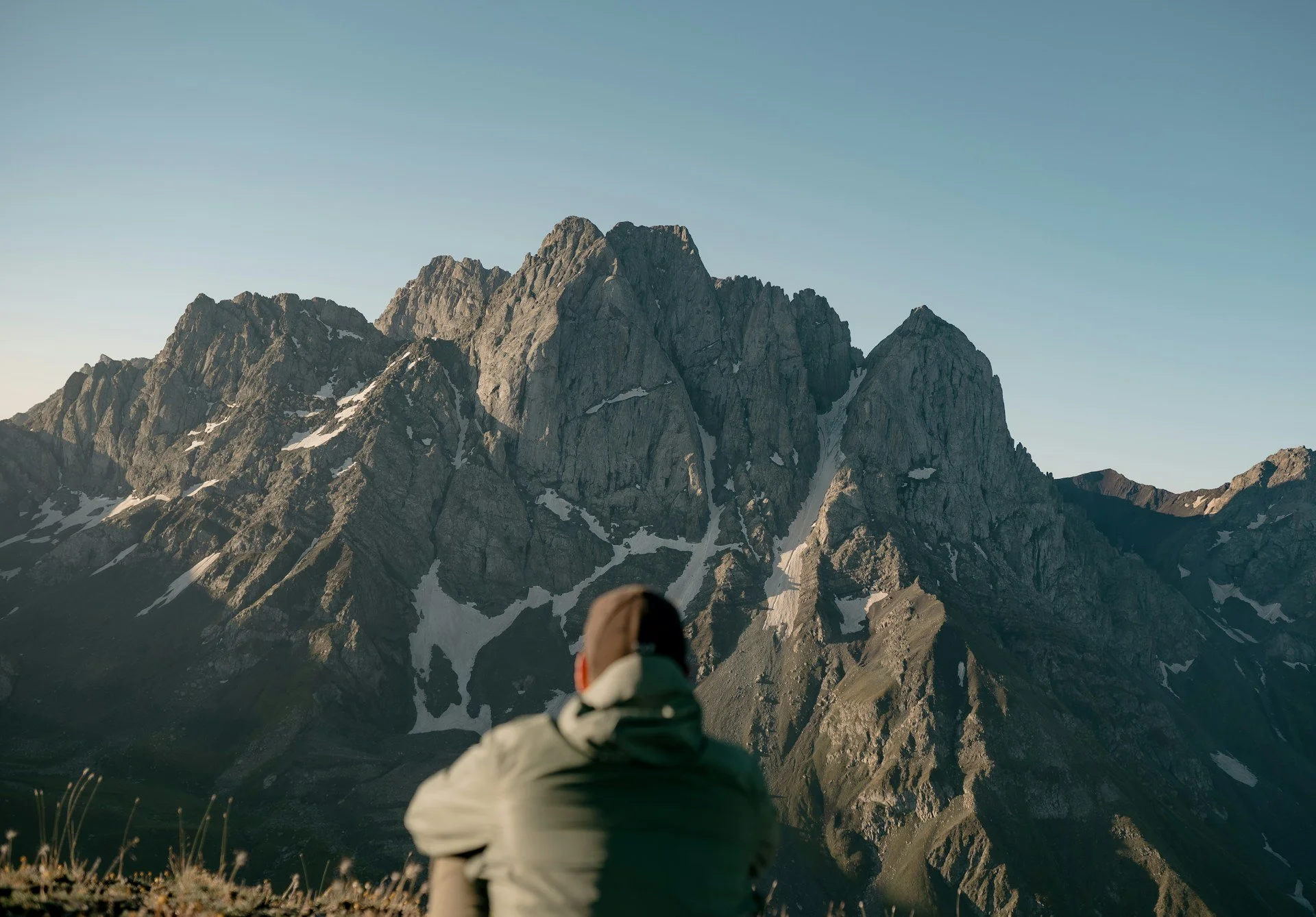 Person overlooking a mountain range representing moving forward despite anxiety through ACT therapy