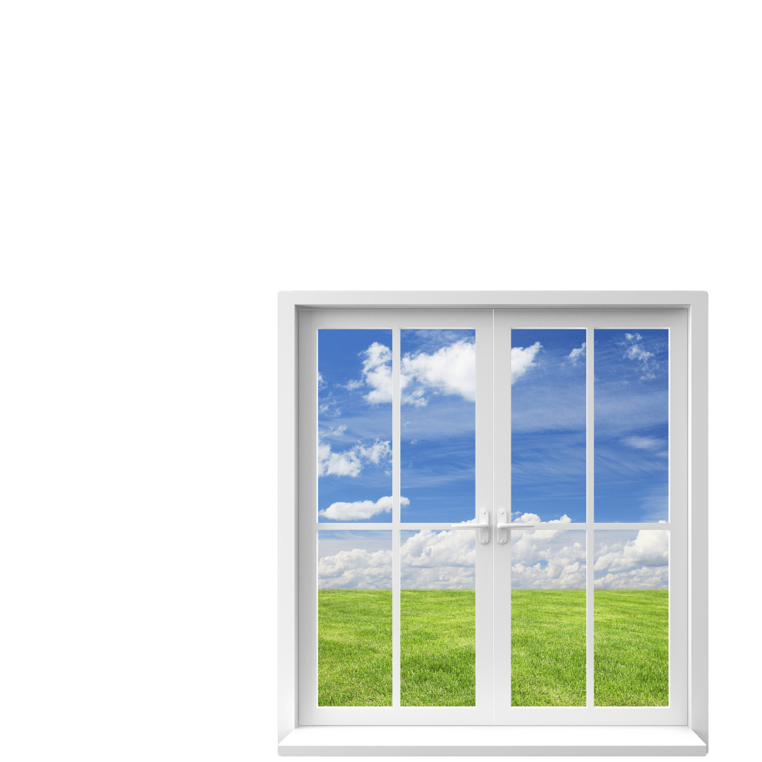 A white-framed window showing a view of a grassy field under a blue sky with clouds.