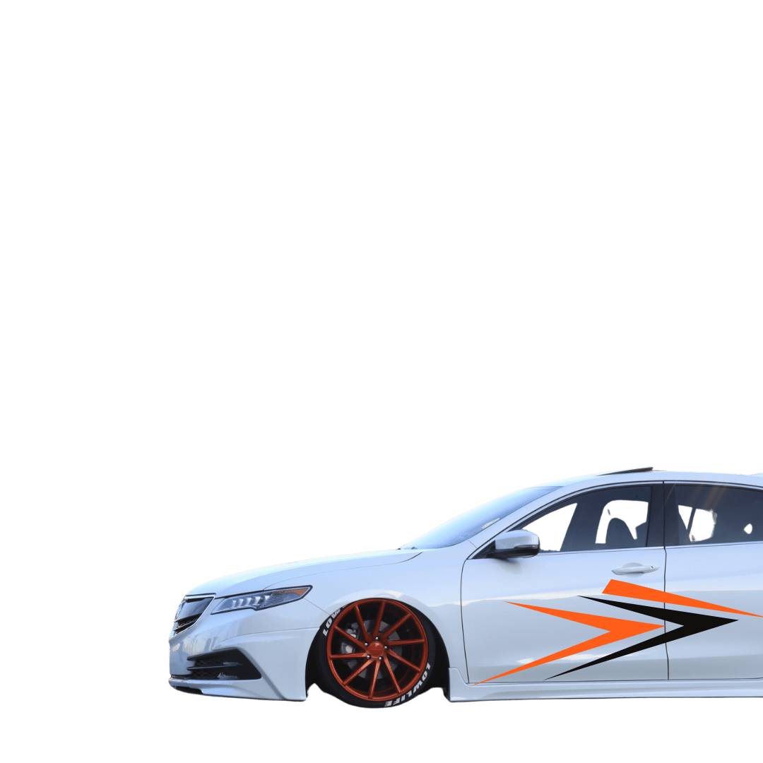 Customized white sedan with orange wheels and black-orange side decals.