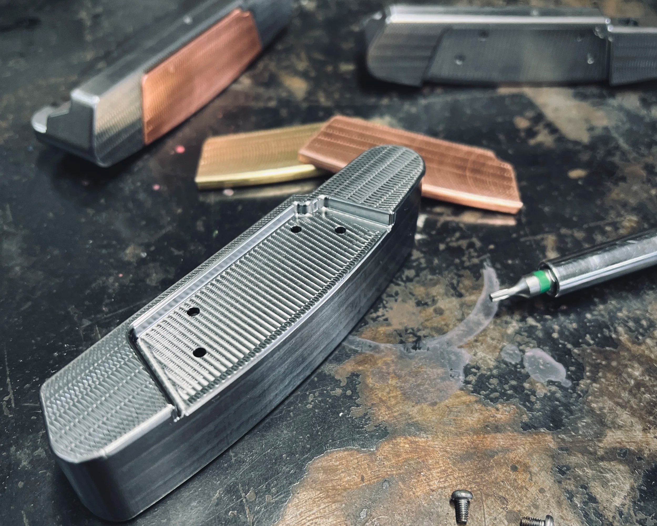 CNC milled putters with brass and copper face inserts to alter the feedback to a golfer