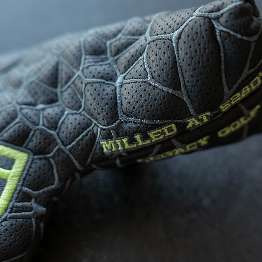 A Legacy Golf "JT" Maker badge blade-style putter cover with embroidery.