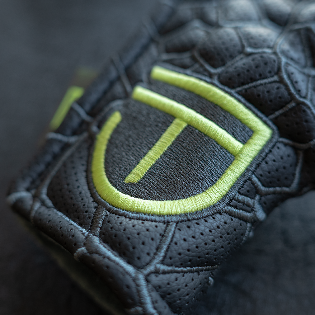 A Legacy Golf "JT" Maker badge blade-style putter cover with embroidery.