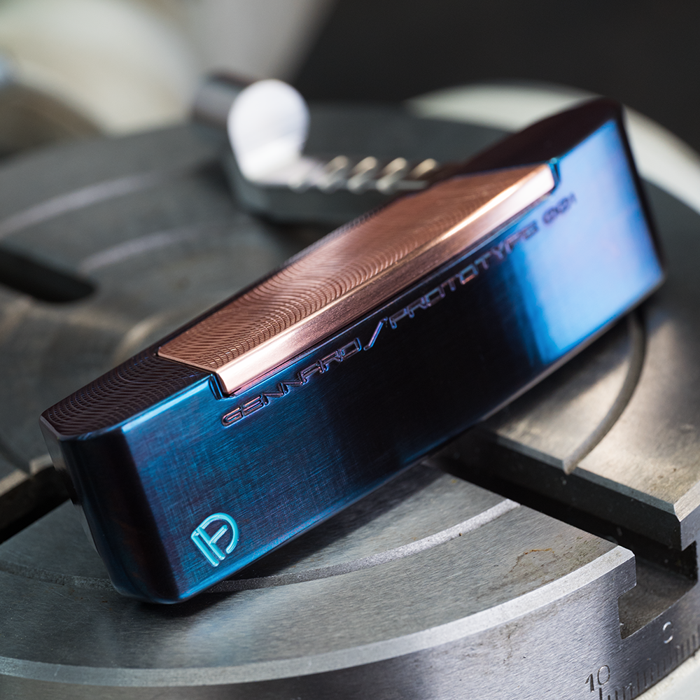 Legacy Goods milled custom putter with blue torched finish and copper face insert created by Jonathan Tenkely.