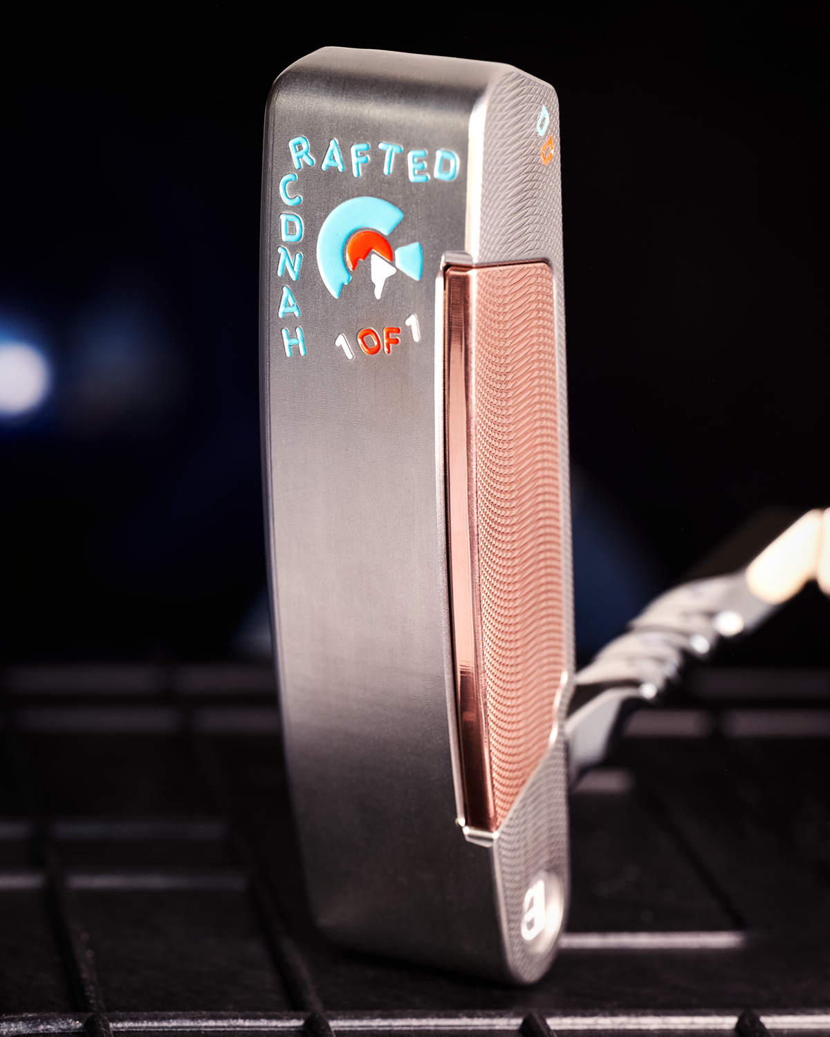 Legacy Goods milled custom putter with stainless steel finish and copper face insert created by Jonathan Tenkely.