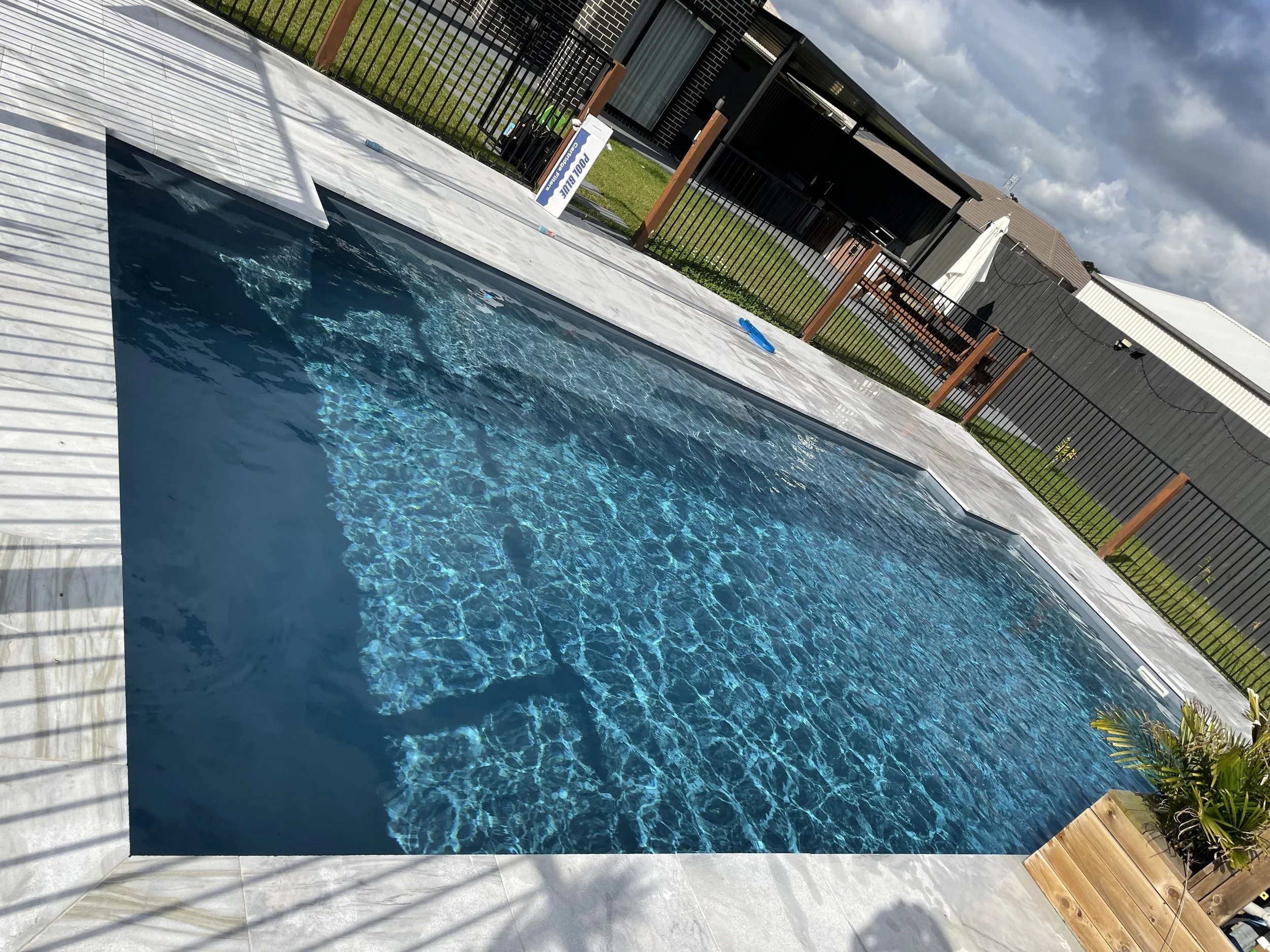 rectangular pool shimmering in the sun