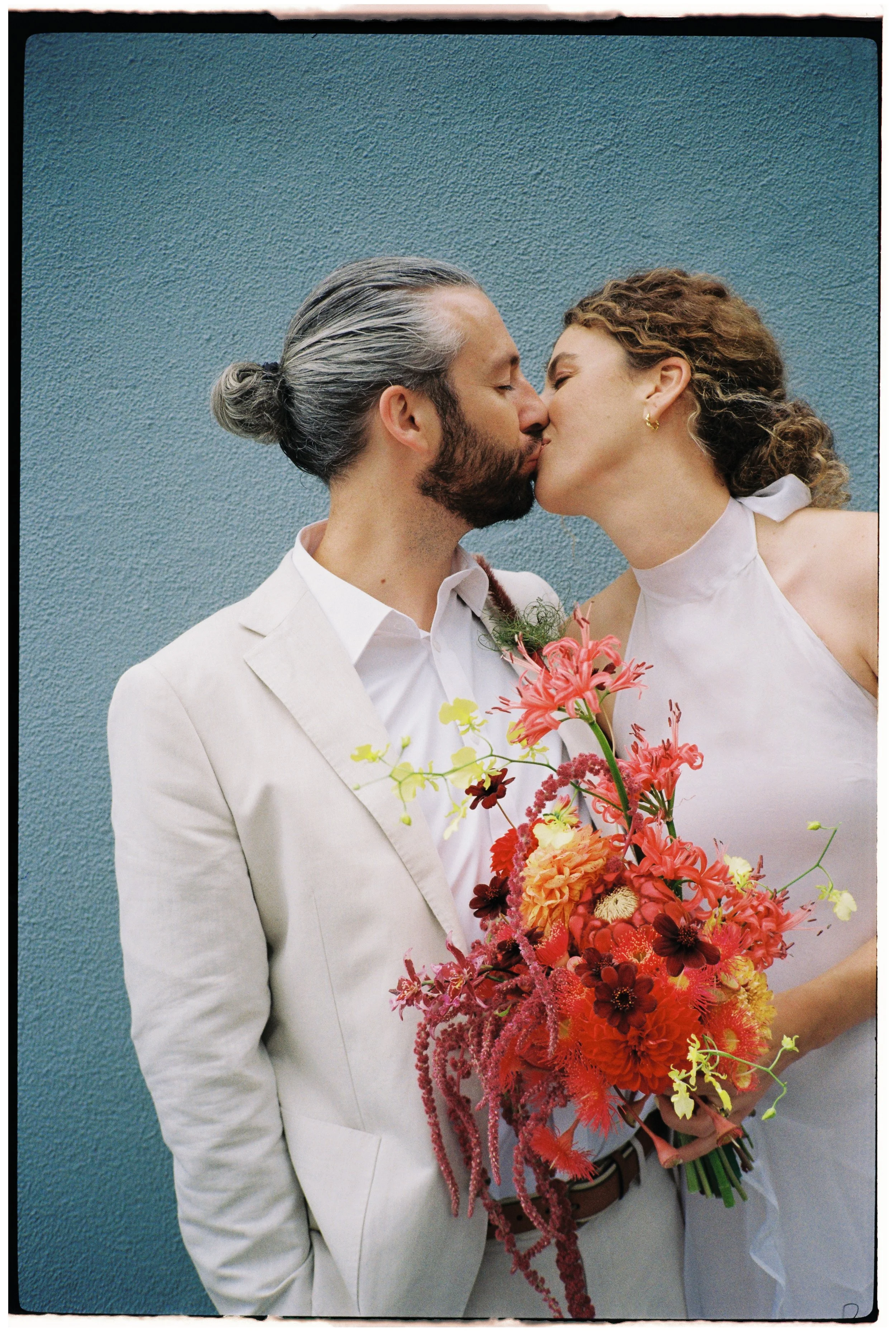 Kate and Regan holding their Honey. Image captured by Miranda Stokkel