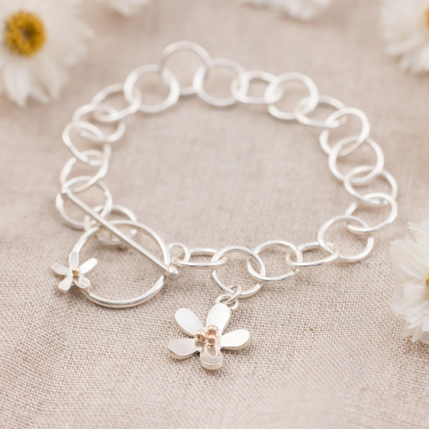 Say hello to the newest additions to the Daisy Collection 🌼✨

Just in time for daisy season, we&rsquo;ve introduced the prettiest new sterling silver daisy toggle bracelet &mdash; delicate, elegant, and made for effortless summer styling. Finished w