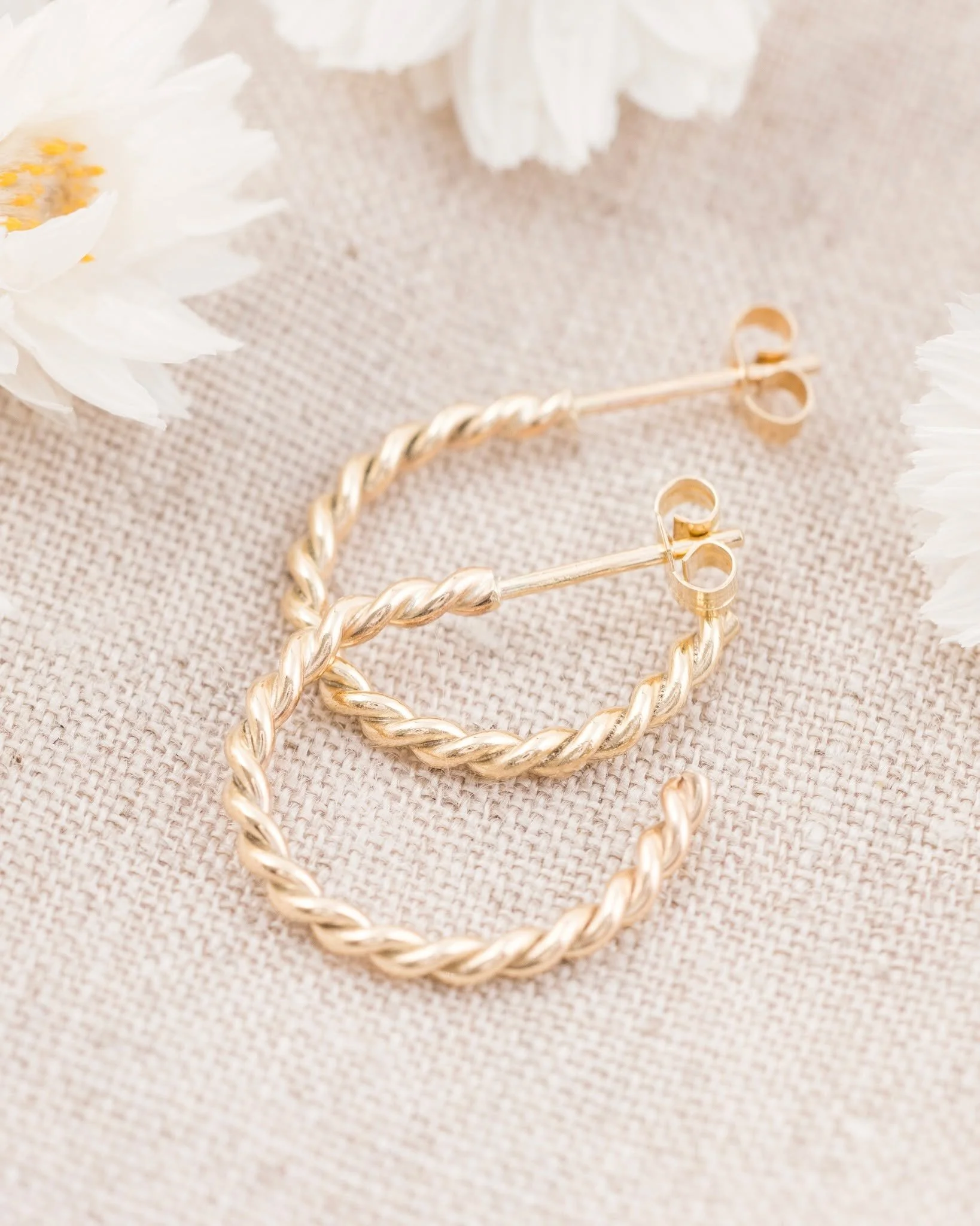 A little sunshine you can wear. ✨

Our handcrafted 9ct yellow gold twist hoop earrings are all about understated detail &mdash; a classic hoop with a beautifully tactile twist.

Warm, polished and effortlessly wearable, they catch the light with ever