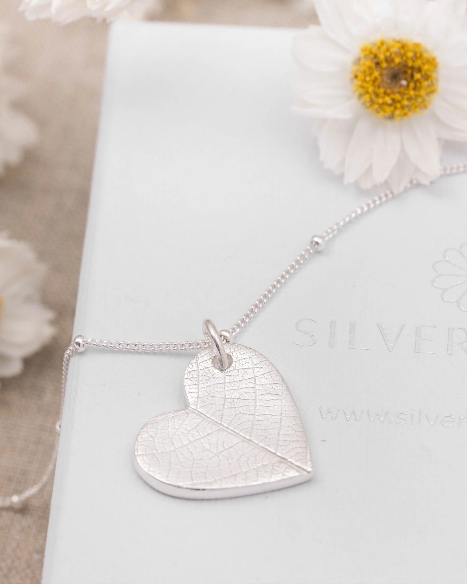 A tiny detail from nature, captured forever in silver.

Look closely at our Silver Heart Leaf Print Necklace and you&rsquo;ll discover the intricate network of lines and textures found within a real leaf.

It&rsquo;s those little details that make na