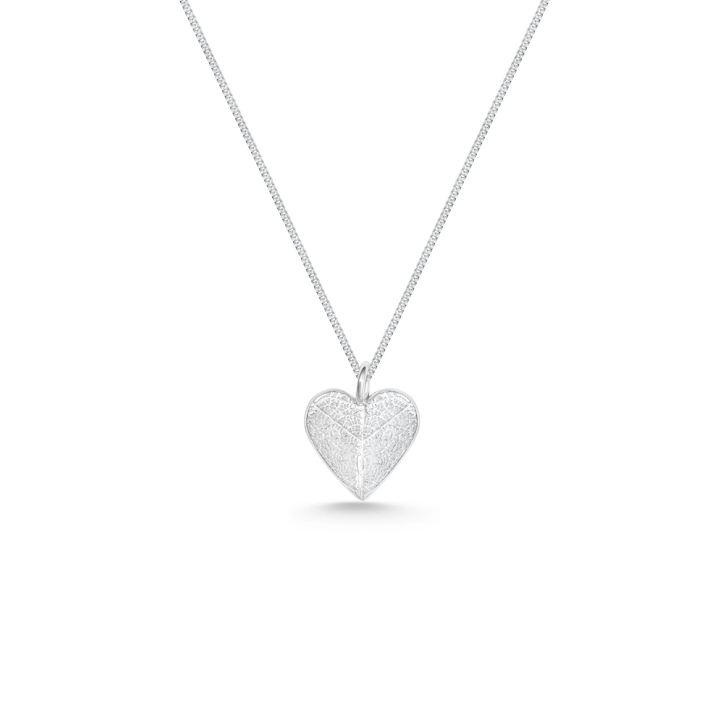 Handmade sterling silver heart pendant with delicate leaf vein texture on a fine silver chain necklace.