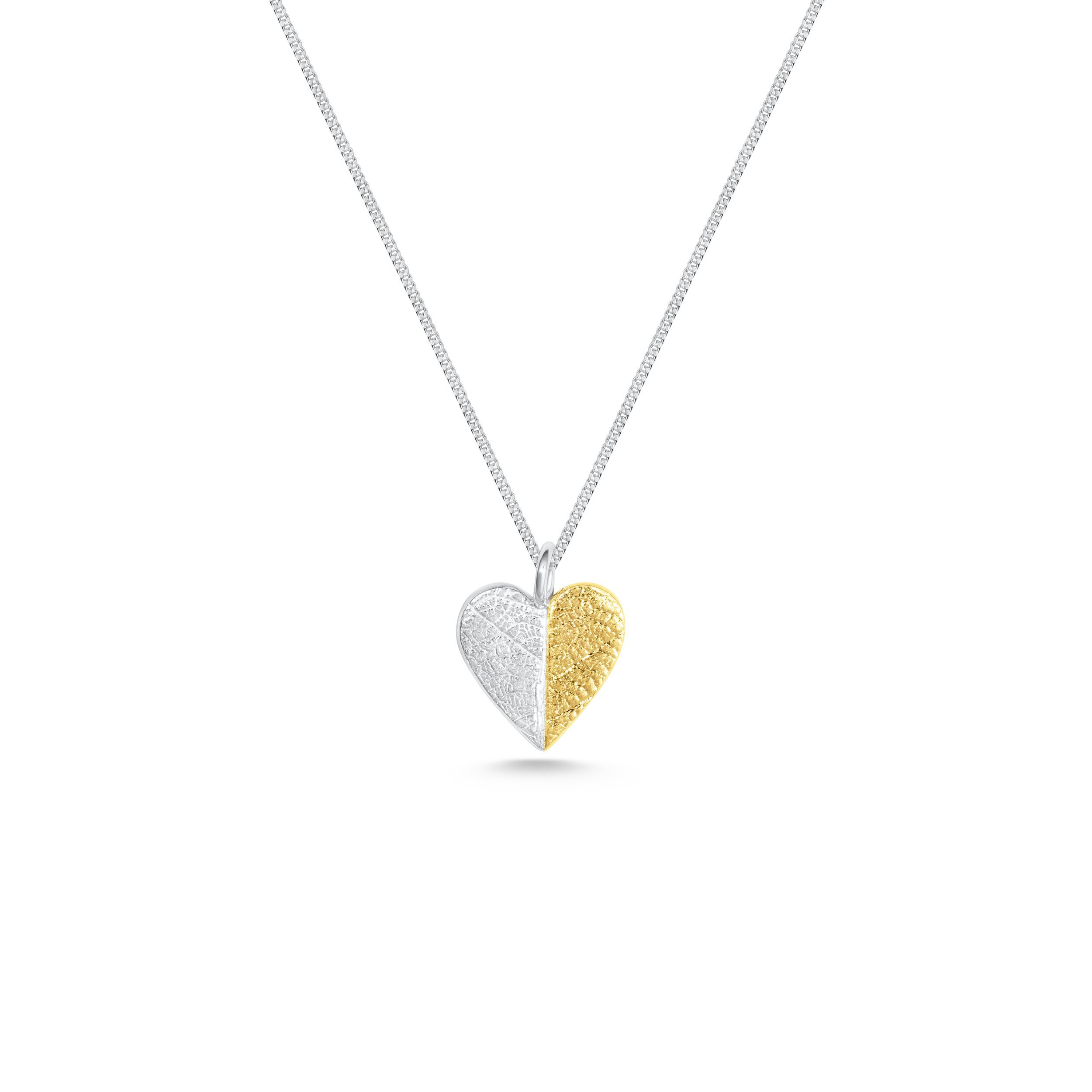 Gold and silver heart leaf pendant necklace with textured leaf pattern on a fine silver chain, handmade botanical jewellery.