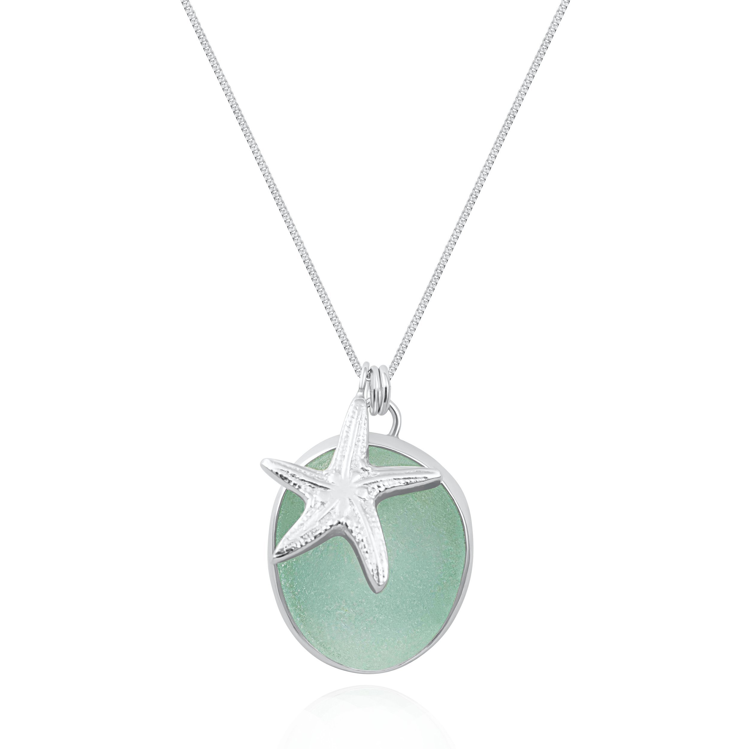 Aquamarine sea glass pebble and sterling silver starfish pendant cluster on a fine silver chain. Coastal inspired jewellery by Silver Daisy.