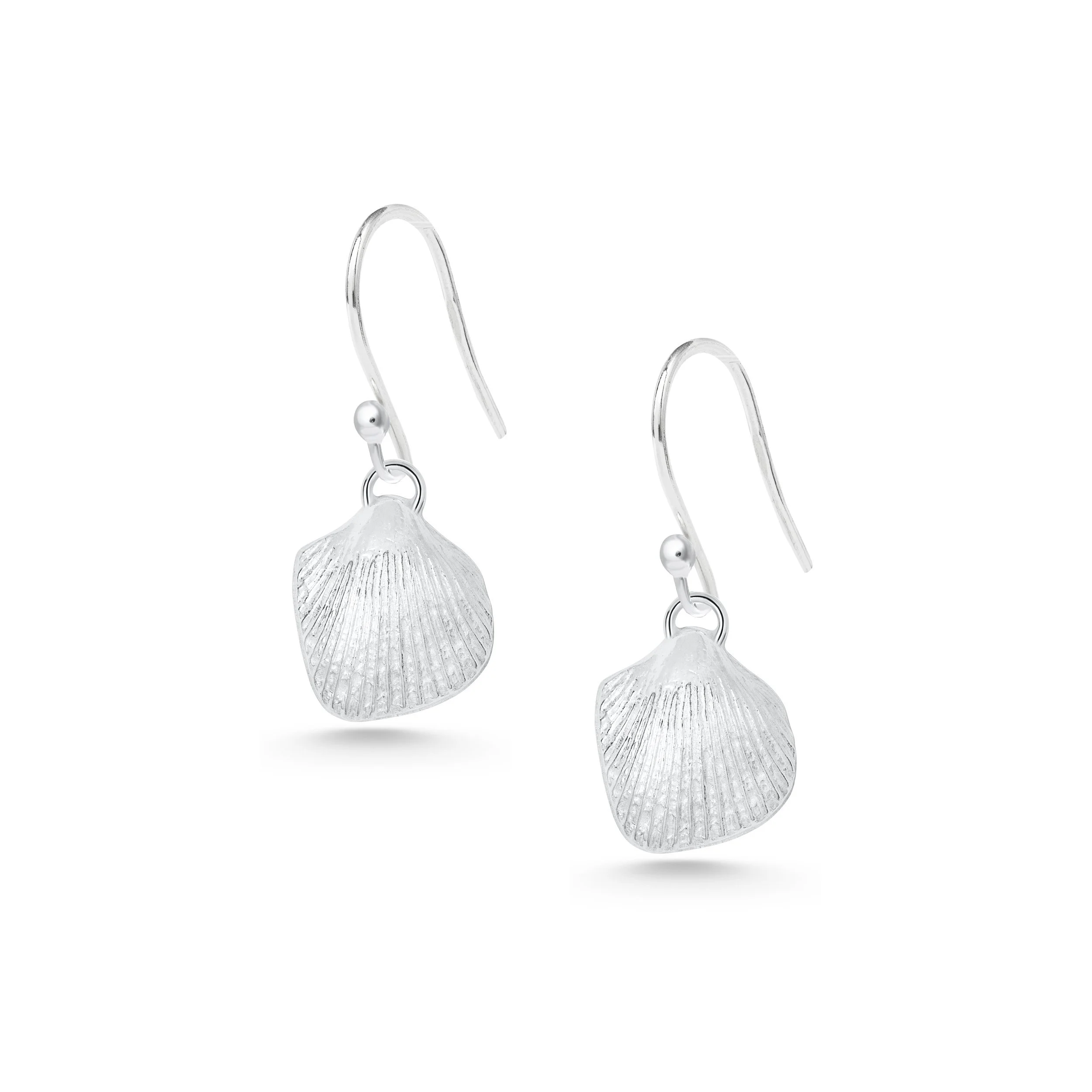 Sterling silver cockle shell drop earrings with detailed textured shells and polished finish, hanging from simple hook wires.