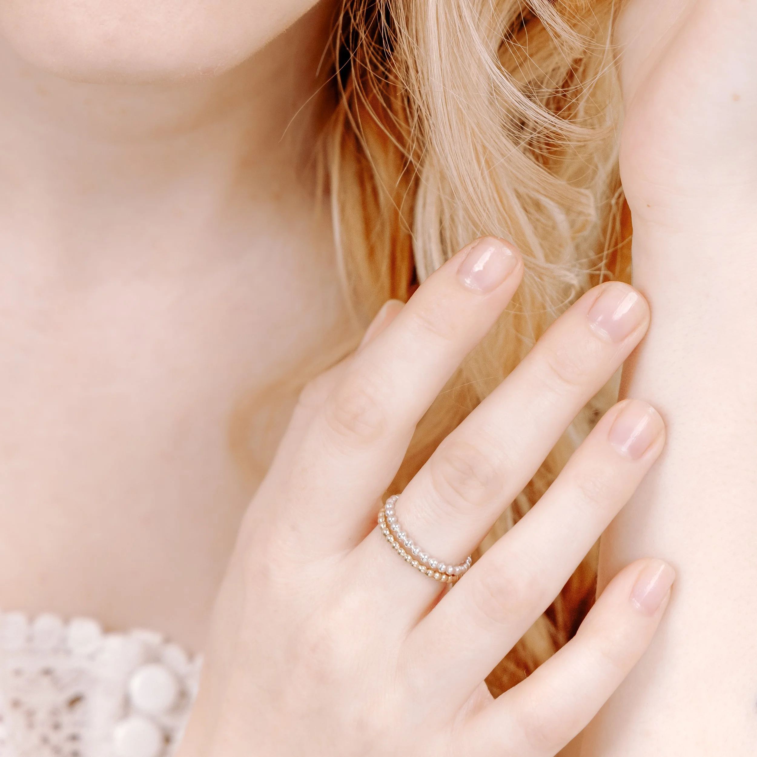 Sterling silver bobble stacking ring with polished beaded band, minimalist design ideal for layering or everyday wear.