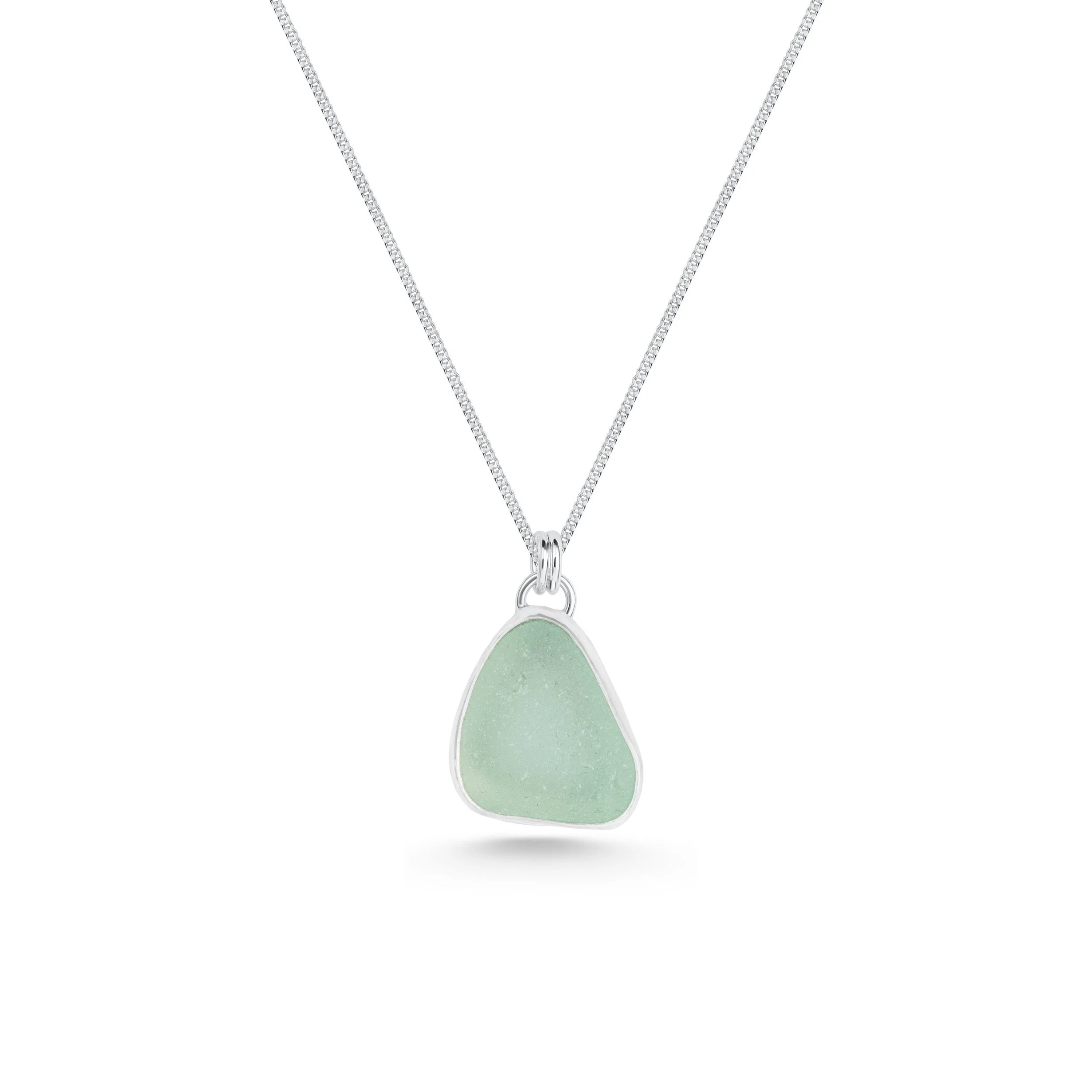 Aqua sea glass pebble set in polished silver on a delicate chain, coastal-inspired handmade necklace.