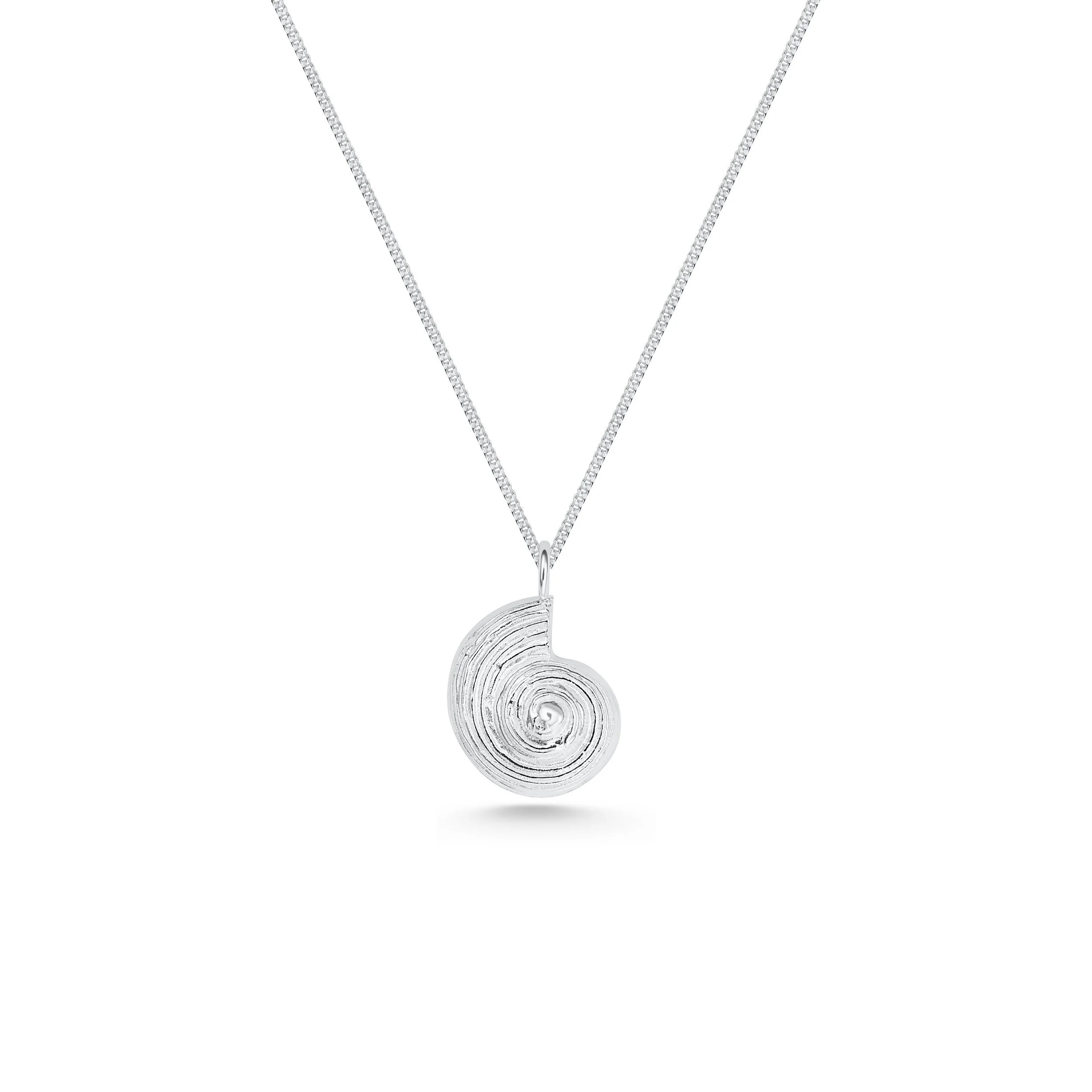 Sterling silver pendant necklace with a detailed fossil ammonite design on a fine chain, inspired by coastal and seaside jewellery.