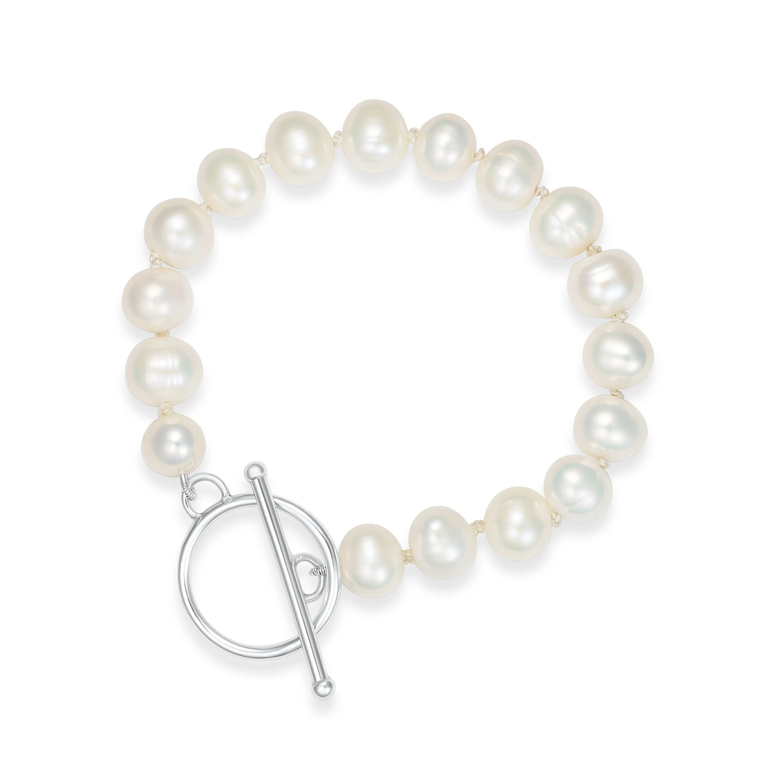 Ivory freshwater pearl bracelet with sterling silver toggle clasp hand knotted onto silk thread. An elegant and timeless design.