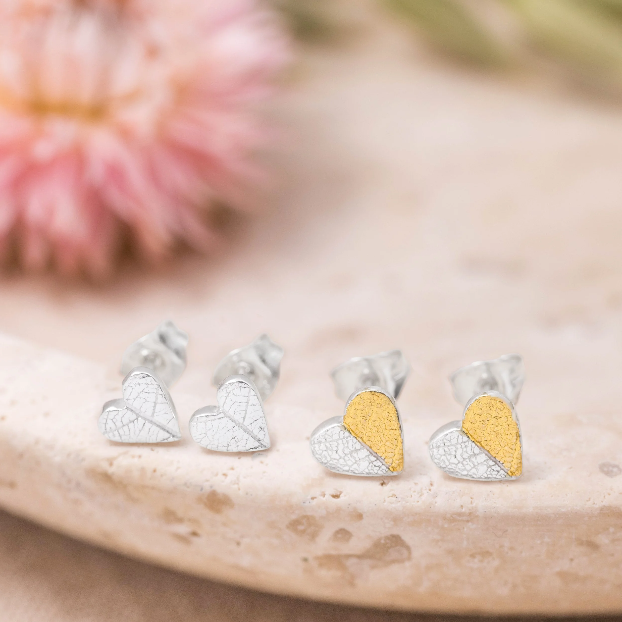 Mini sterling silver heart stud earrings with delicate leaf print texture and 24ct gold keum-boo accents.