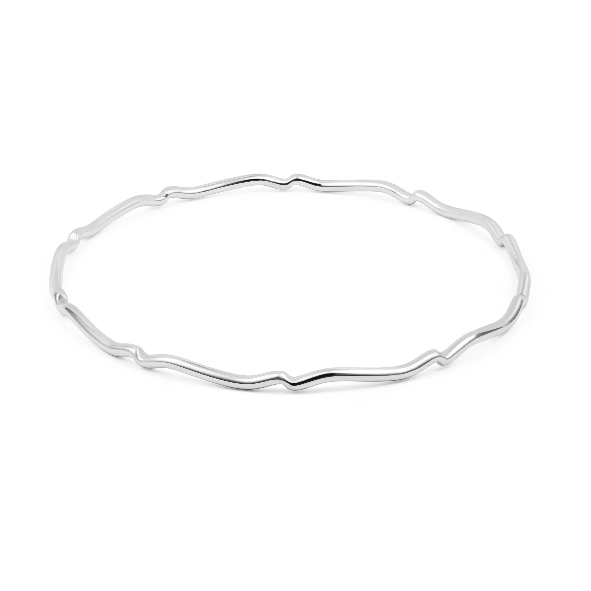 Sterling silver scalloped bangle with polished finish, featuring a wavy edge design for elegant stacking or standalone wear.