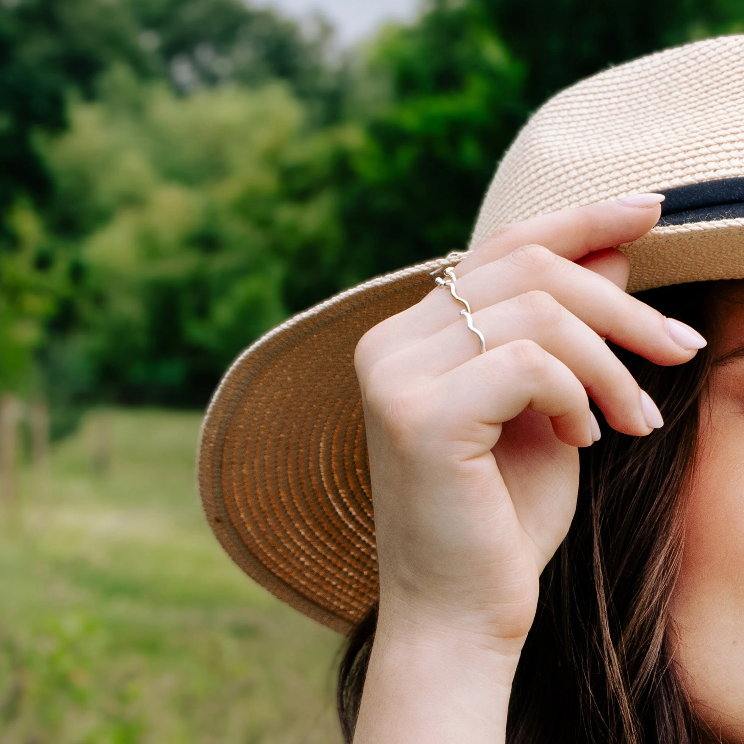 9ct yellow gold wave stacking ring with a polished curved band designed for layering or wearing solo.