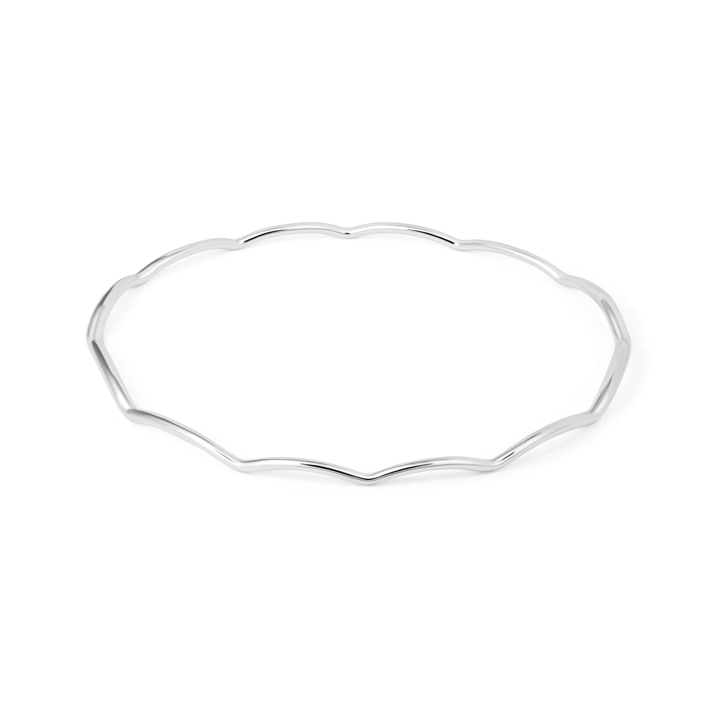 Slim sterling silver stacking bangle with a polished wave design, perfect for layering in a modern minimalist style or simply worn alone.