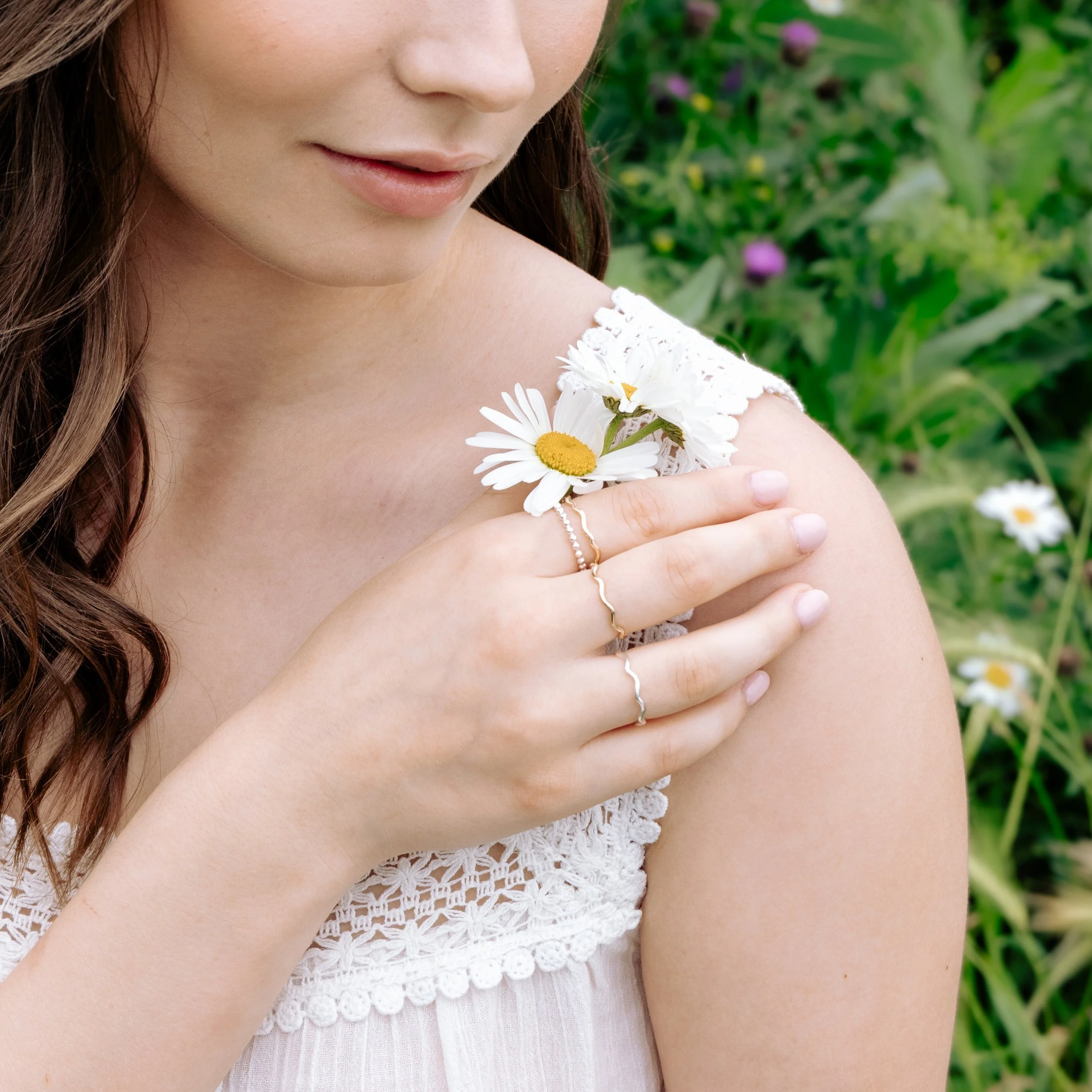 Sterling silver stacking ring with a smooth wave design and polished finish, ideal for layering in minimalist jewellery styles.