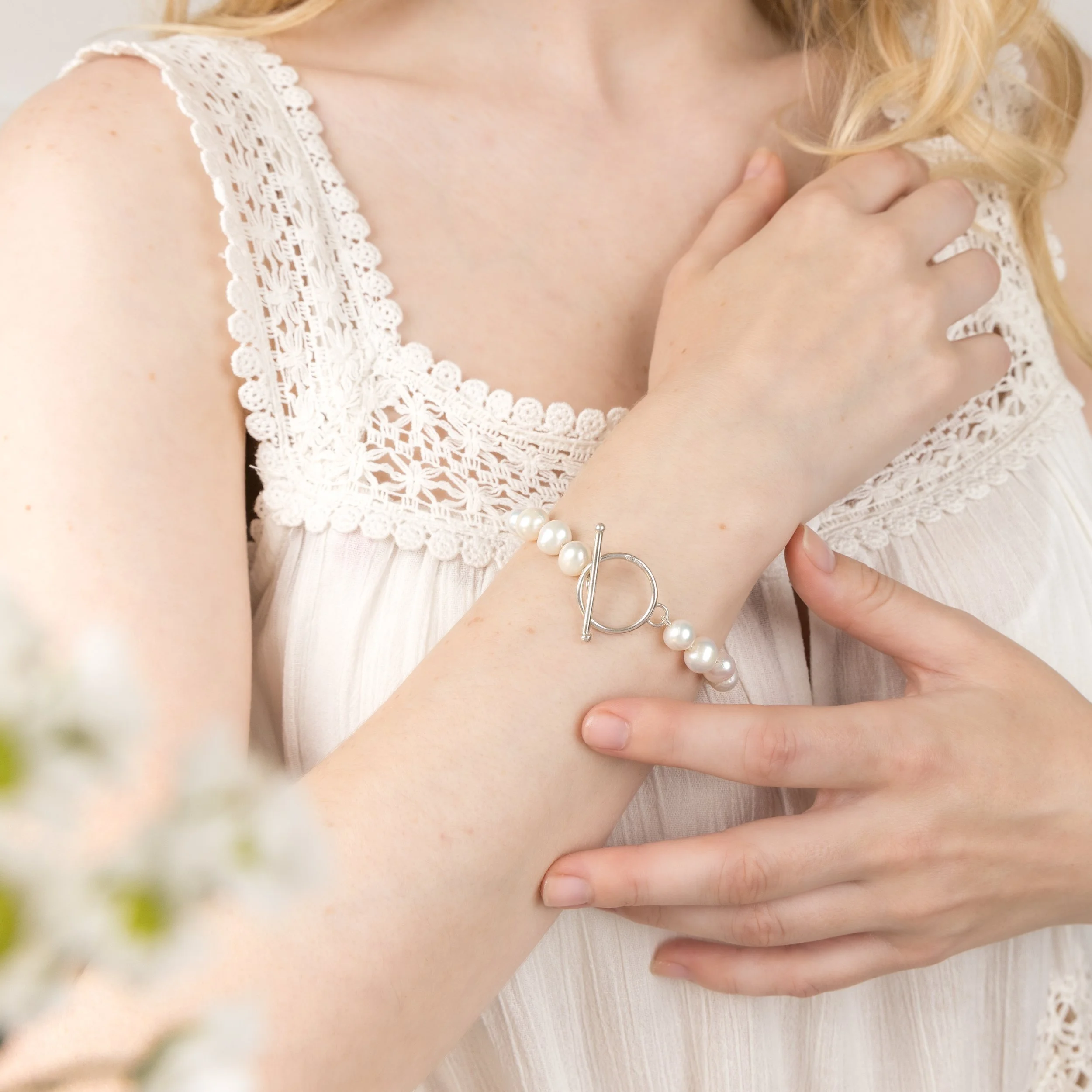 Ivory freshwater pearl bracelet with sterling silver toggle clasp hand knotted onto silk thread. An elegant and timeless design.