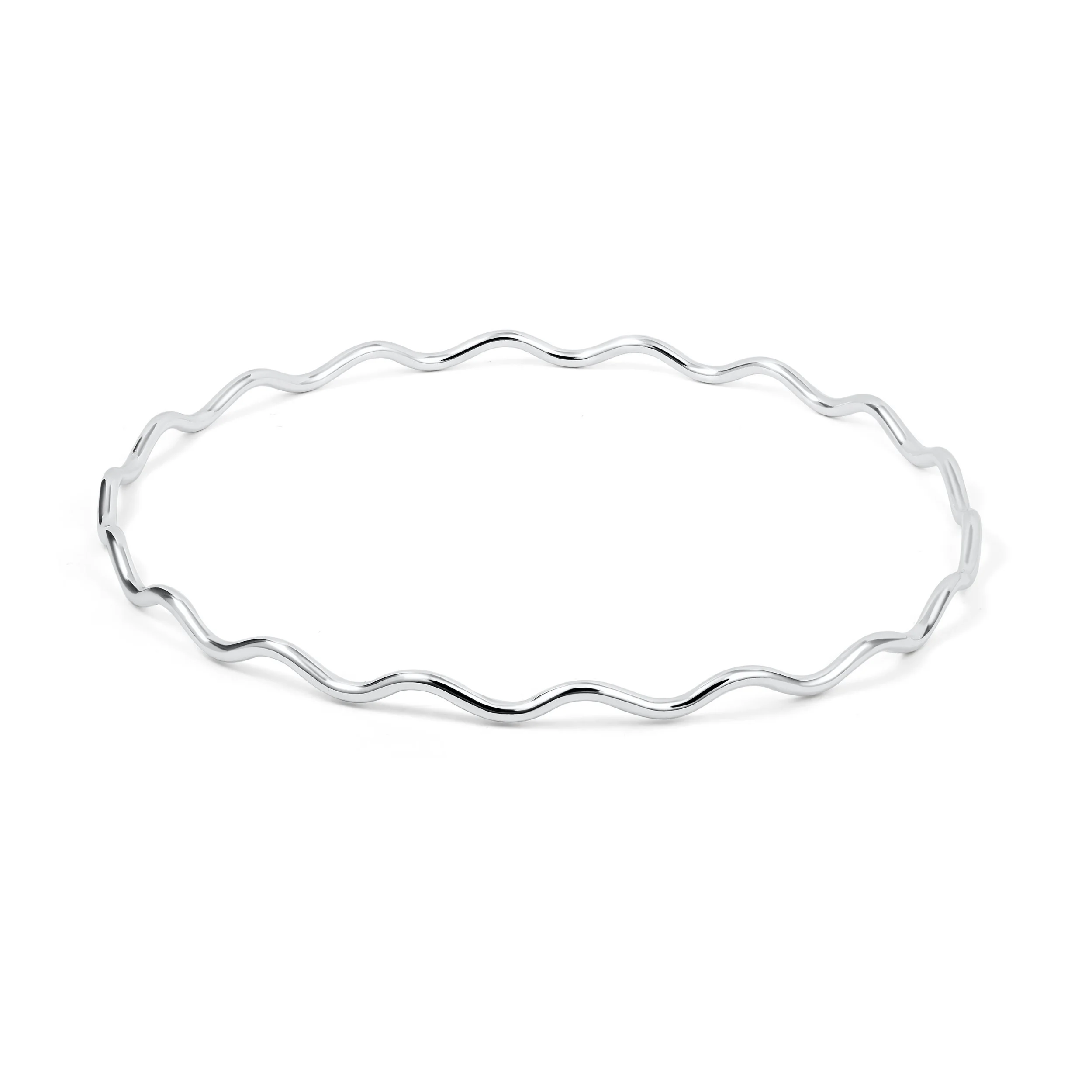 Sterling silver scallop stacking bangle with softly curved edges and polished wave detailing, designed for layering or elegantly worn alone.