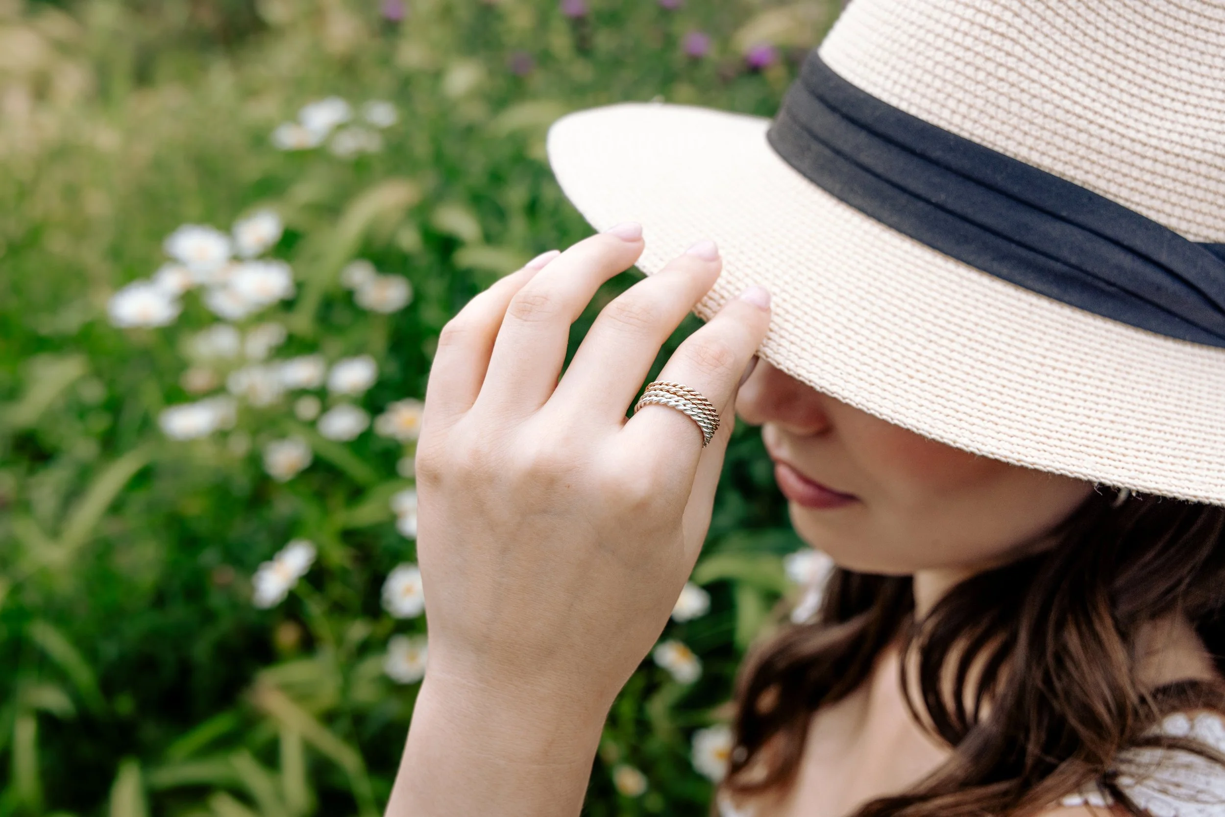 Delicate 9ct rose gold stacking ring with a twisted rope design, polished finish, ideal for layering or wearing as a minimalist band.