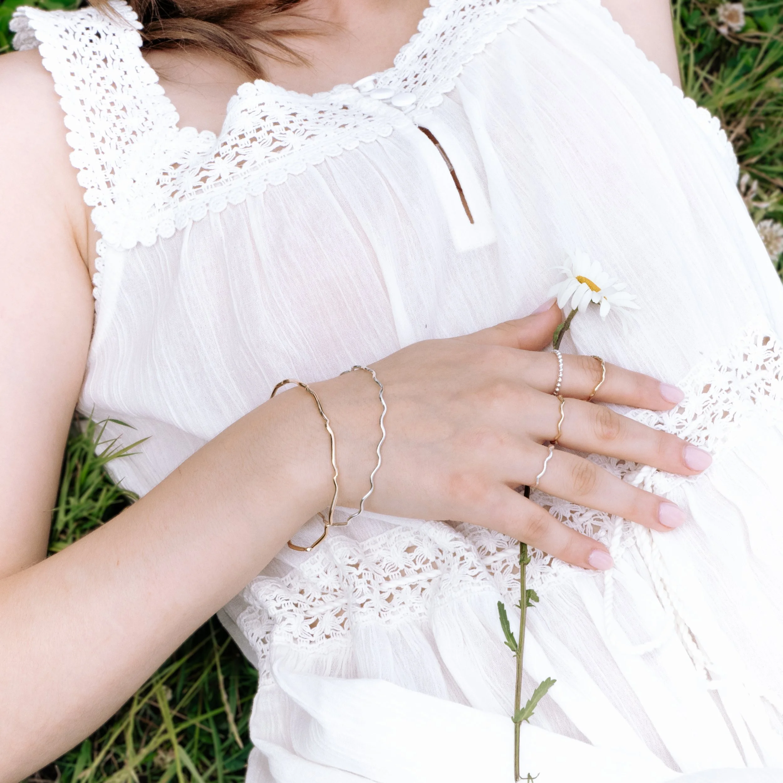 9ct yellow gold scallop-edge stacking ring with polished finish, delicate lightweight band for layering or everyday wear.