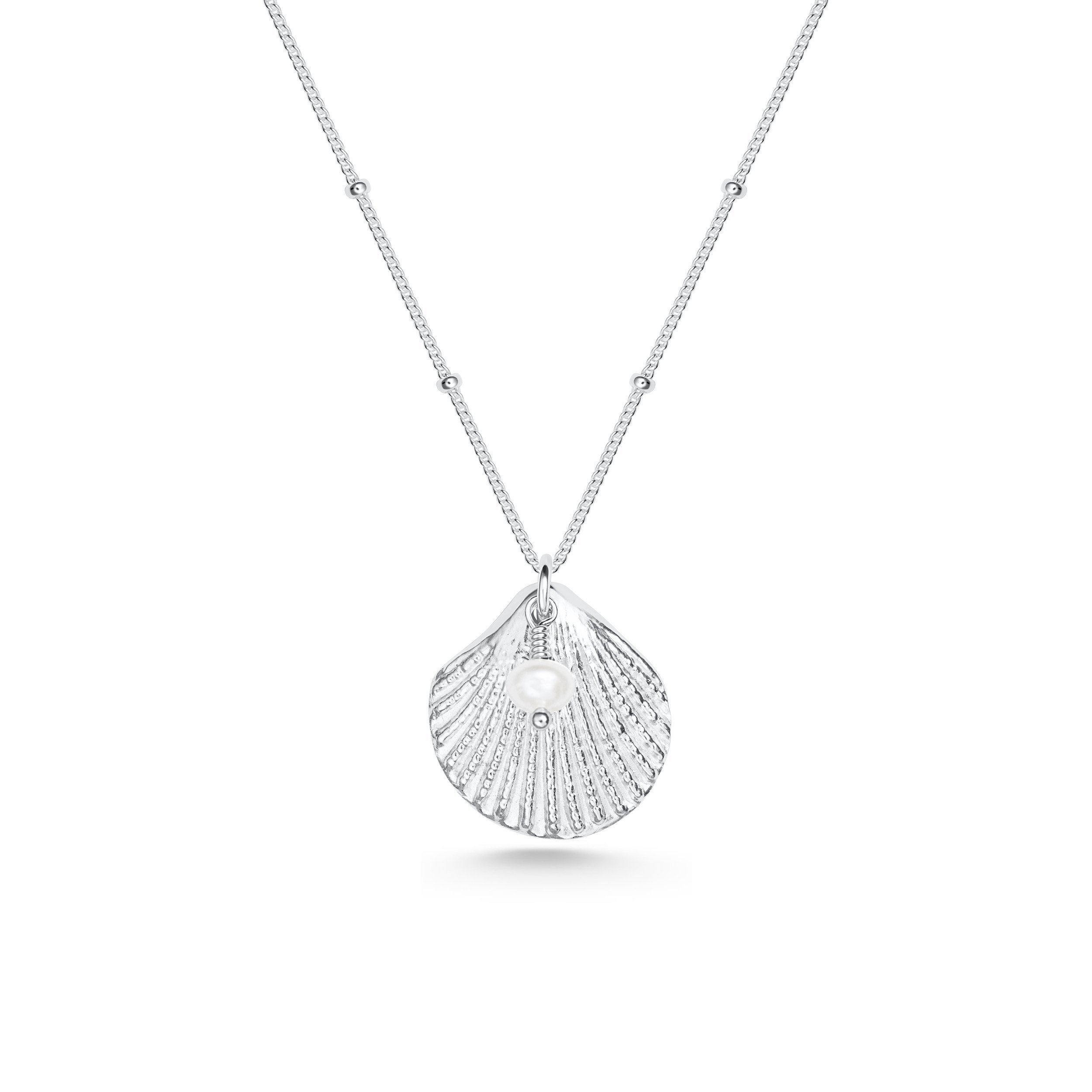 Silver scallop shell pendant necklace with a single white pearl on a delicate chain, inspired by coastal jewellery design.