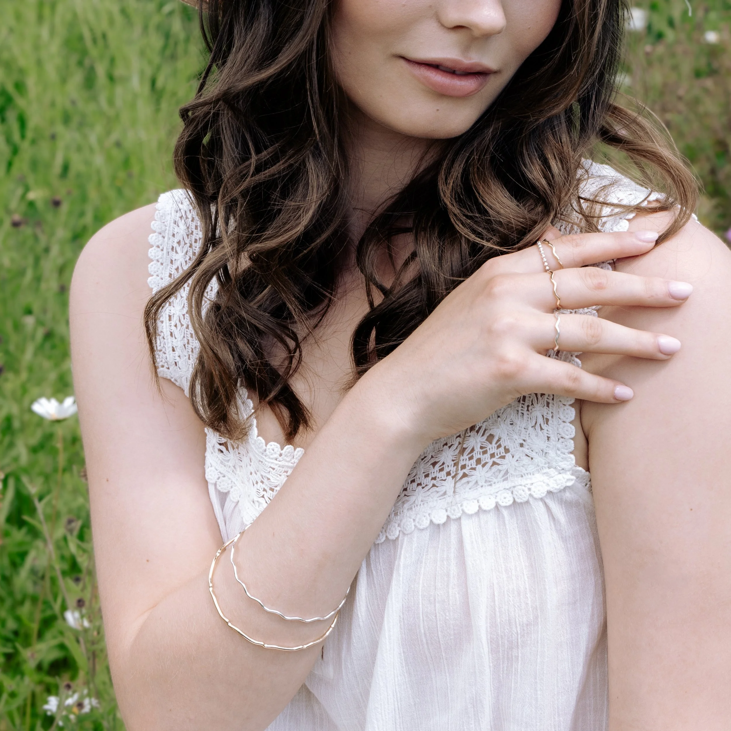 9ct yellow gold scallop bangle with a smooth polished finish and subtle scalloped edge, designed for elegant stacking and everyday wear.