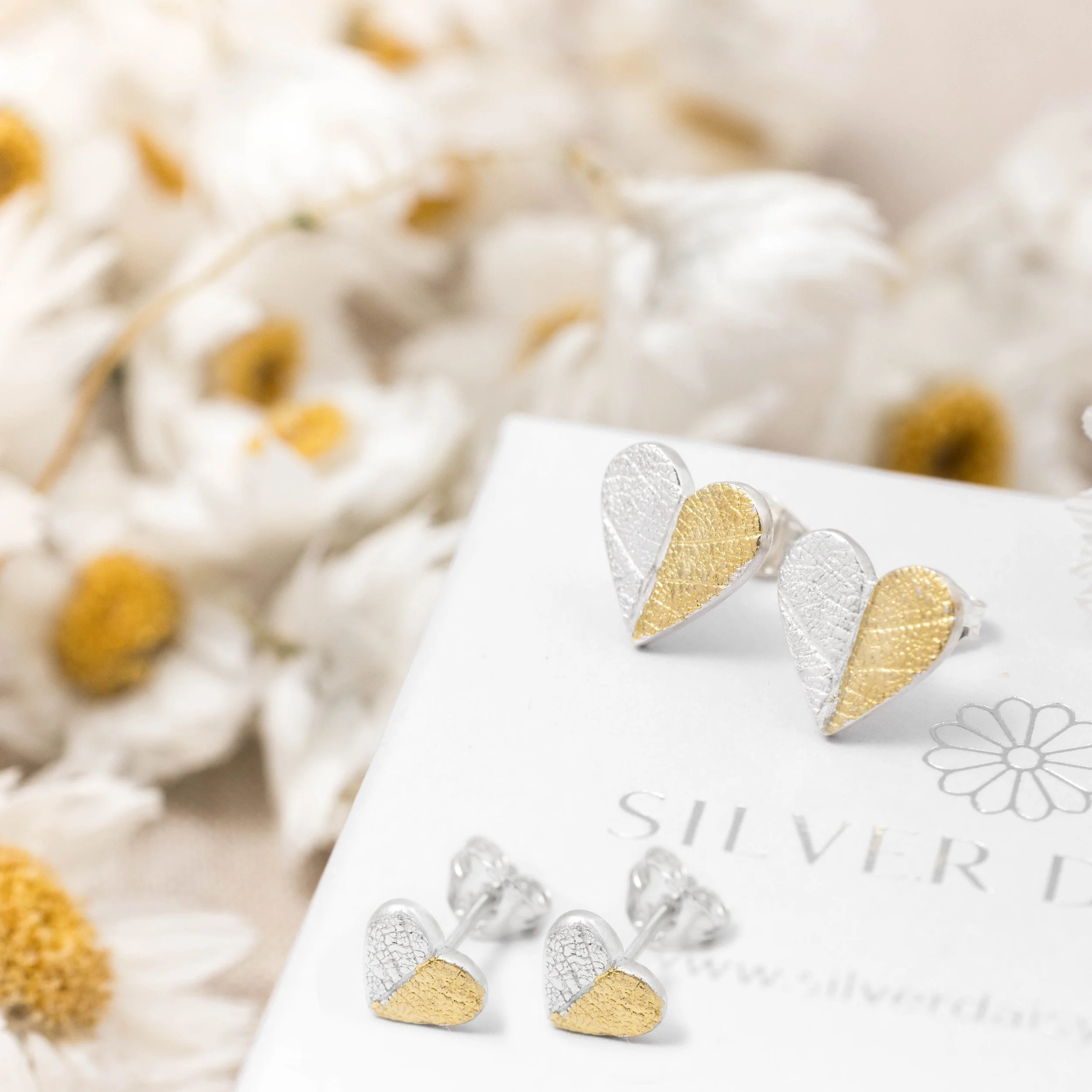 Mini sterling silver heart stud earrings with delicate leaf print texture and 24ct gold keum-boo accents.